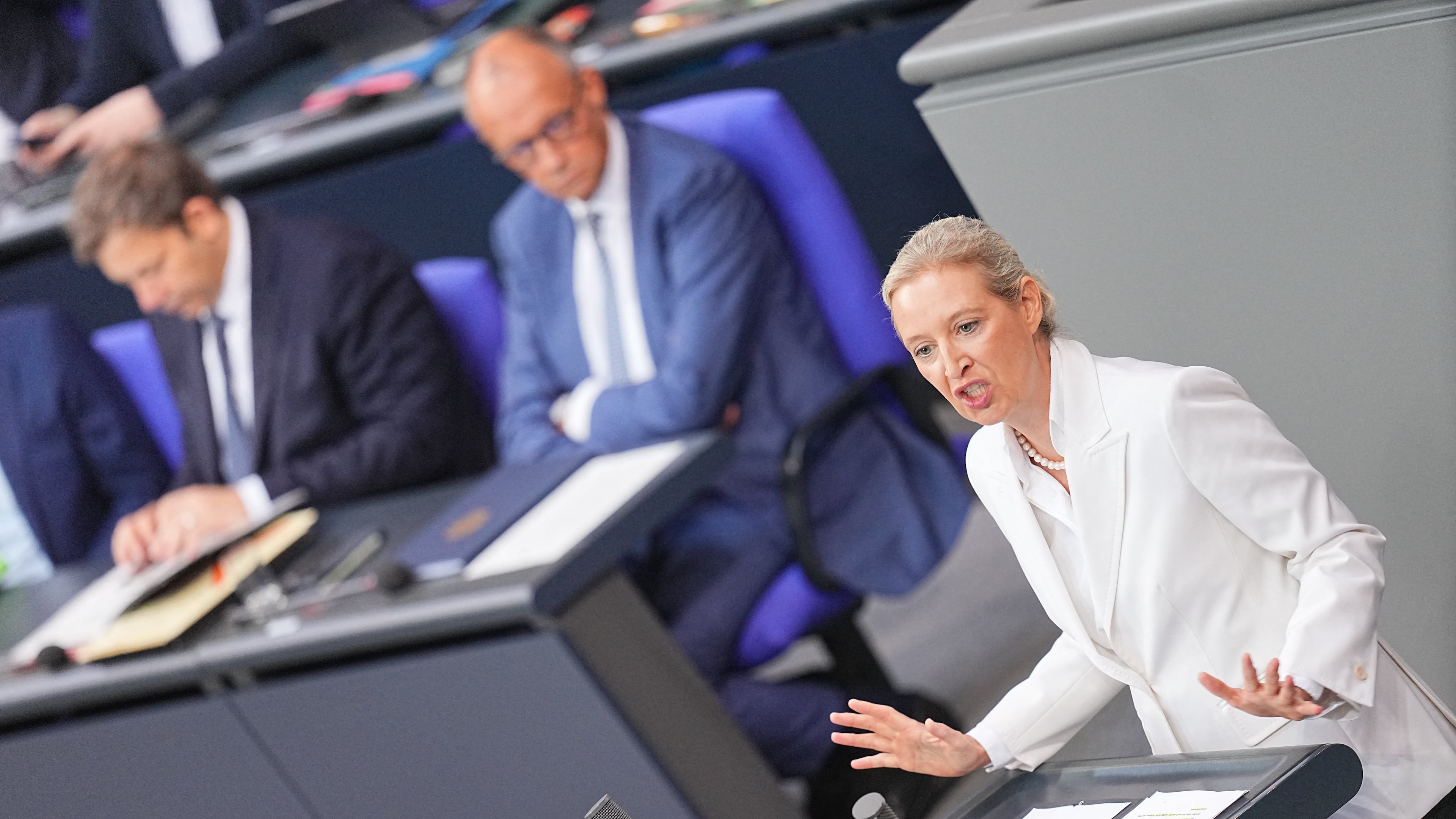 Federal chairwoman and parliamentary group leader of the AfD Alice Weidel opens the general debate as part of the budget deliberations in the Bundestag, with German Chancellor Friedrich Merz sitting on the background, in Berlin, Wednesday Sept. 9, 2026 (Michael Kappeler/dpa via AP)