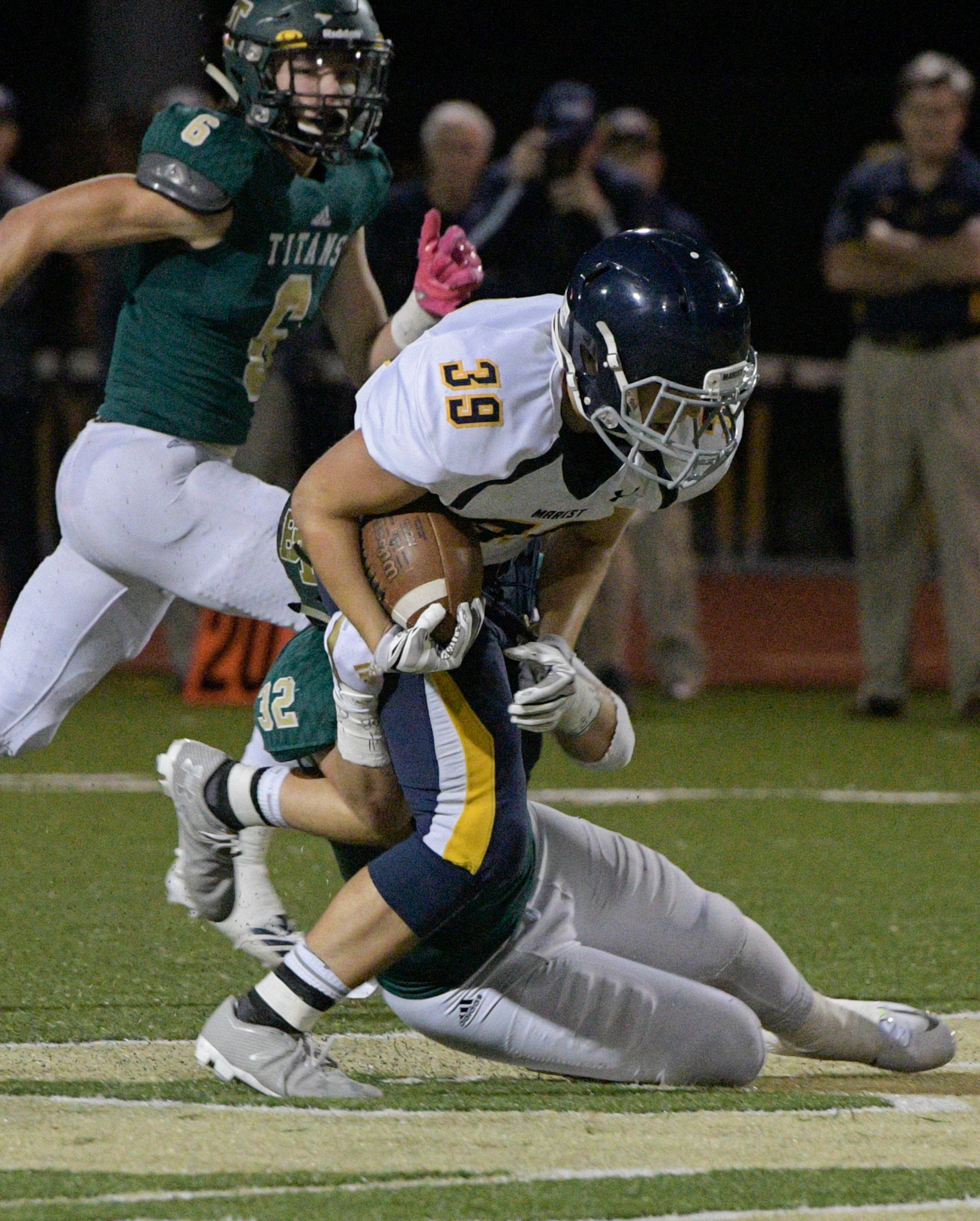 Marist TE Jack Pantlin (38) is tackled by Blessed Trinity LB Jake Rudolph during a high school football game, Friday, Oct. 20, 2017, in Roswell. (John Amis)