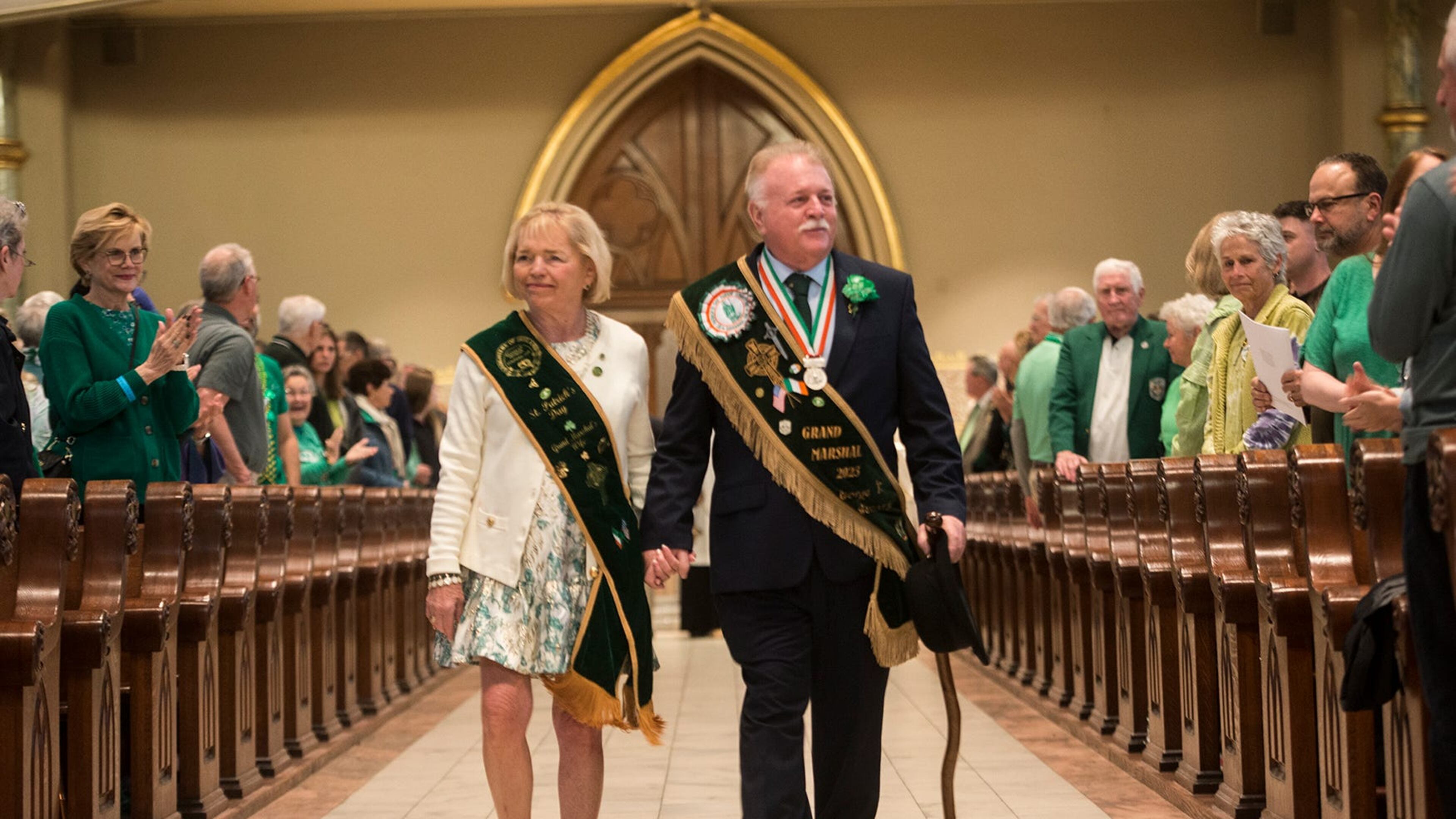 St. Patrick's Day Parade Committee Grand Marshal George Schwarz III and his wife Patricia Hodges Schwarz enter the Cathedral Basilica of St. John the Baptist for St. Patrick's Day Mass. (Photo Courtesy of Will Peebles)