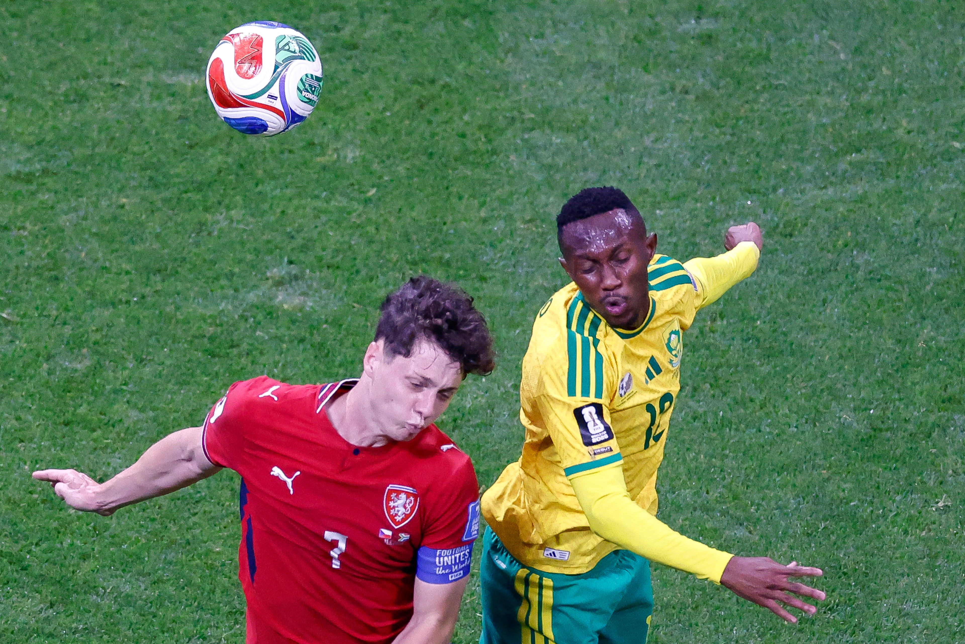 Czechia defender Ladislav Krejčí (left) and South Africa midfielder Thapelo Maseko jump to head the ball in the first half of the Czechia vs. South Africa game at the FIFA World Cup at Atlanta Stadium on Thursday, June 18, 2026. (Arvin Temkar/AJC)