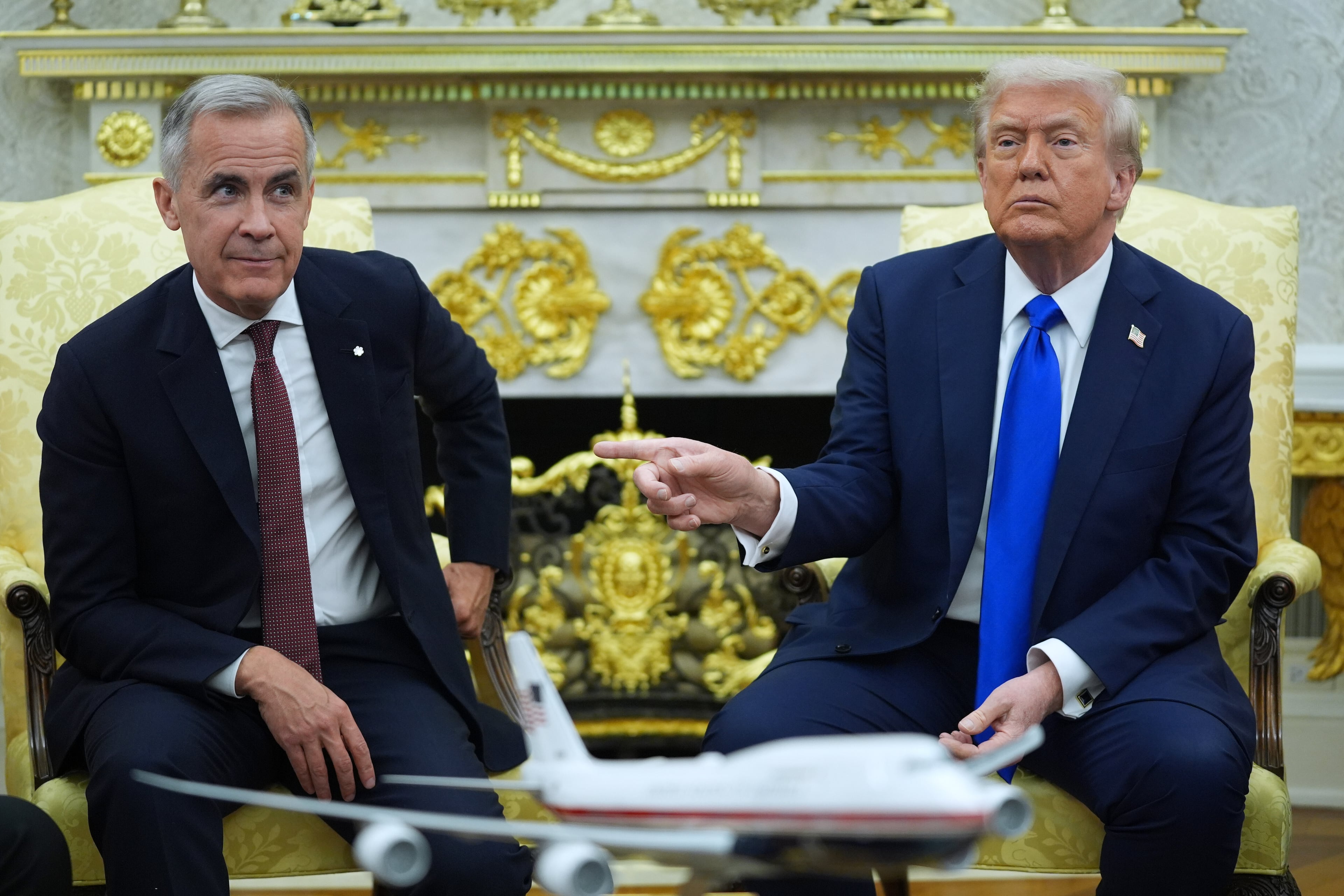 President Donald Trump (right) gestures alongside Canadian Prime Minister Mark Carney as they meet in the Oval Office of the White House in October. (Evan Vucci/AP)