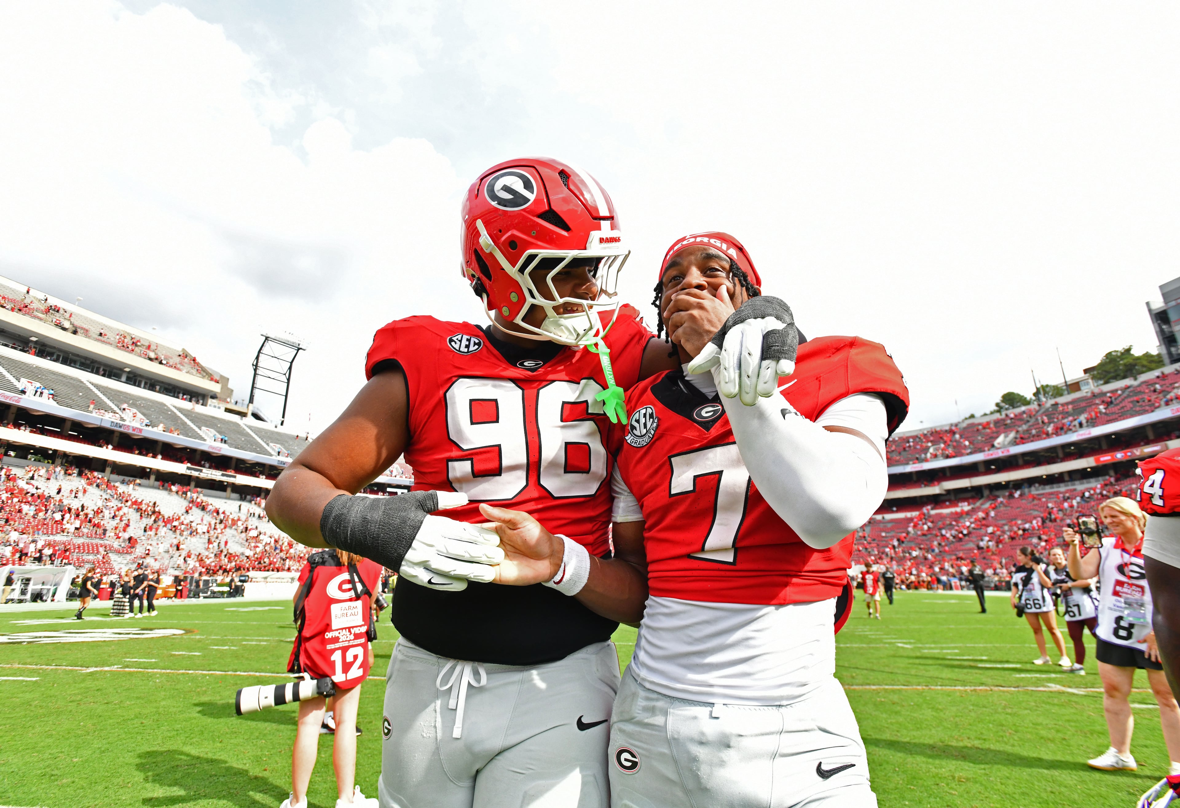 Georgia defensive lineman JJ Hanne (96) and Georgia safety Khalil Barnes (7) celebrate after Georgia defeated Vanderbilt 38-14 during an NCAA football game at Sanford Stadium on Saturday, Oct. 3, 2026, in Athens. (Hyosub Shin/AJC)