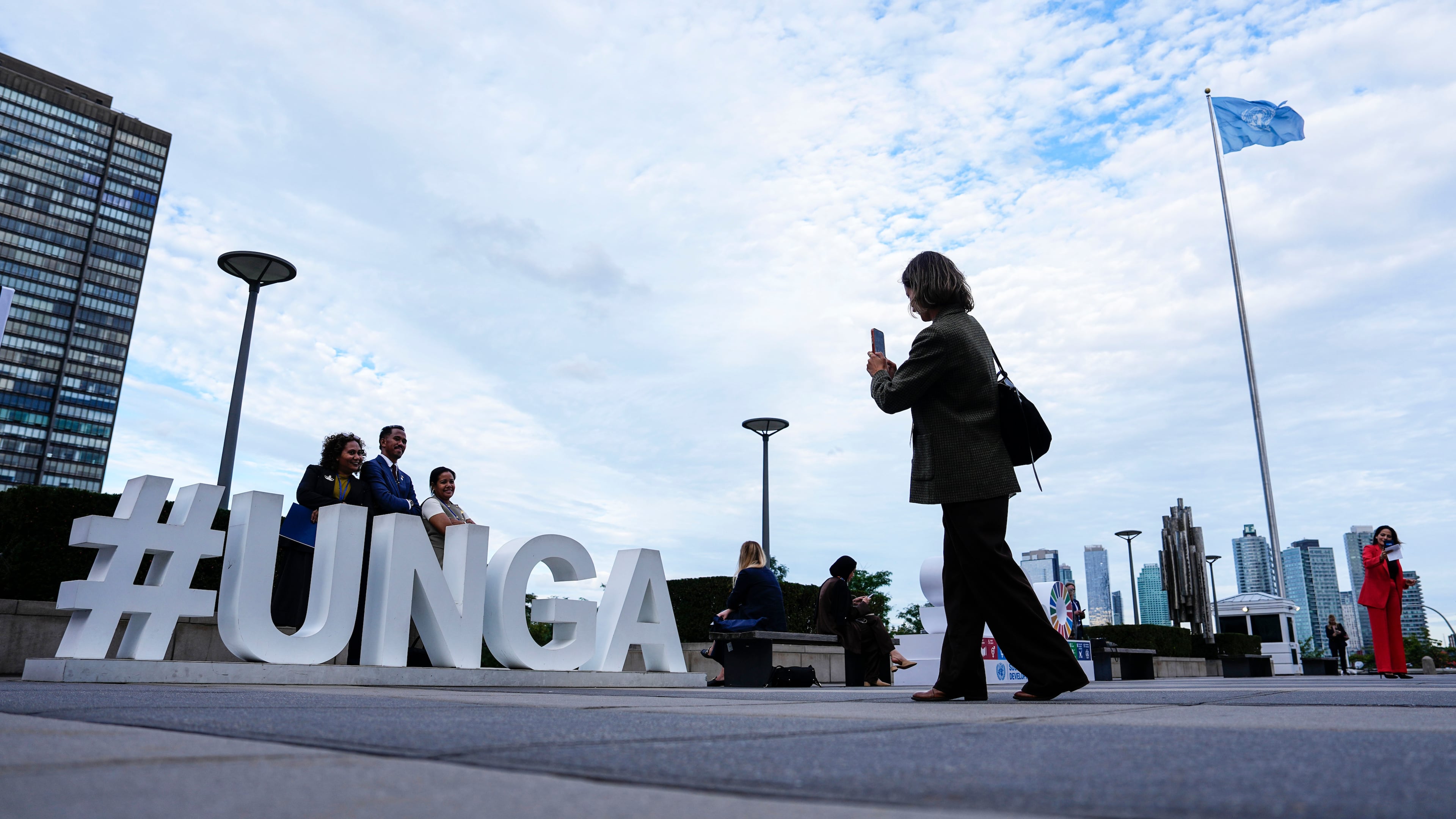 People pose as they arrive for the United Nations General Assembly (UNGA) at the UN headquarters, Monday, Sept. 21, 2026. (Justin Tang/The Canadian Press via AP)