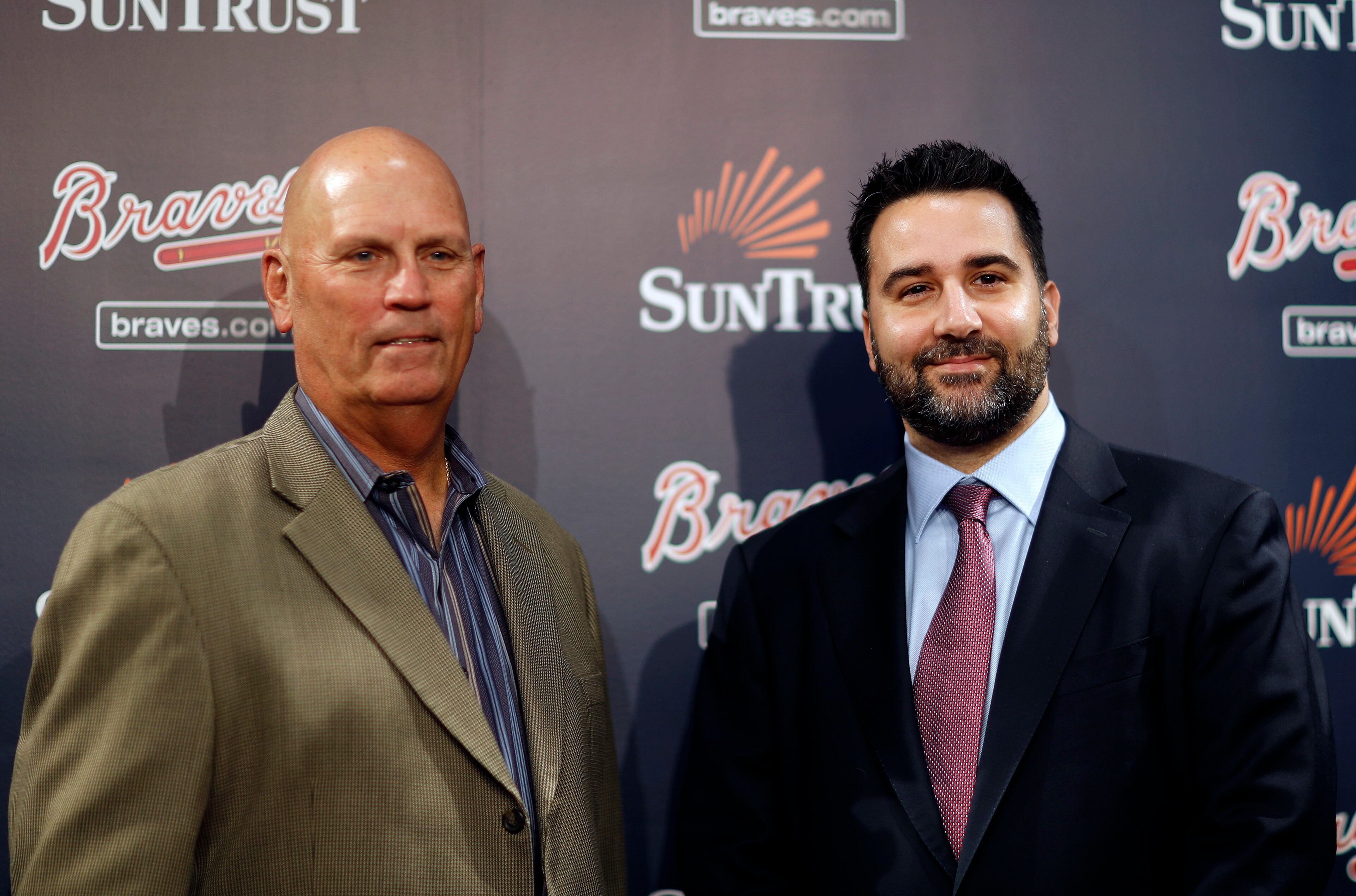 Atlanta Braves manager Brian Snitker, left, poses with Alex Anthopoulos during a photo op at a news conference introducing Anthopoulos as the baseball team's new general manager in Atlanta, Monday, Nov. 13, 2017. (AP Photo/David Goldman)