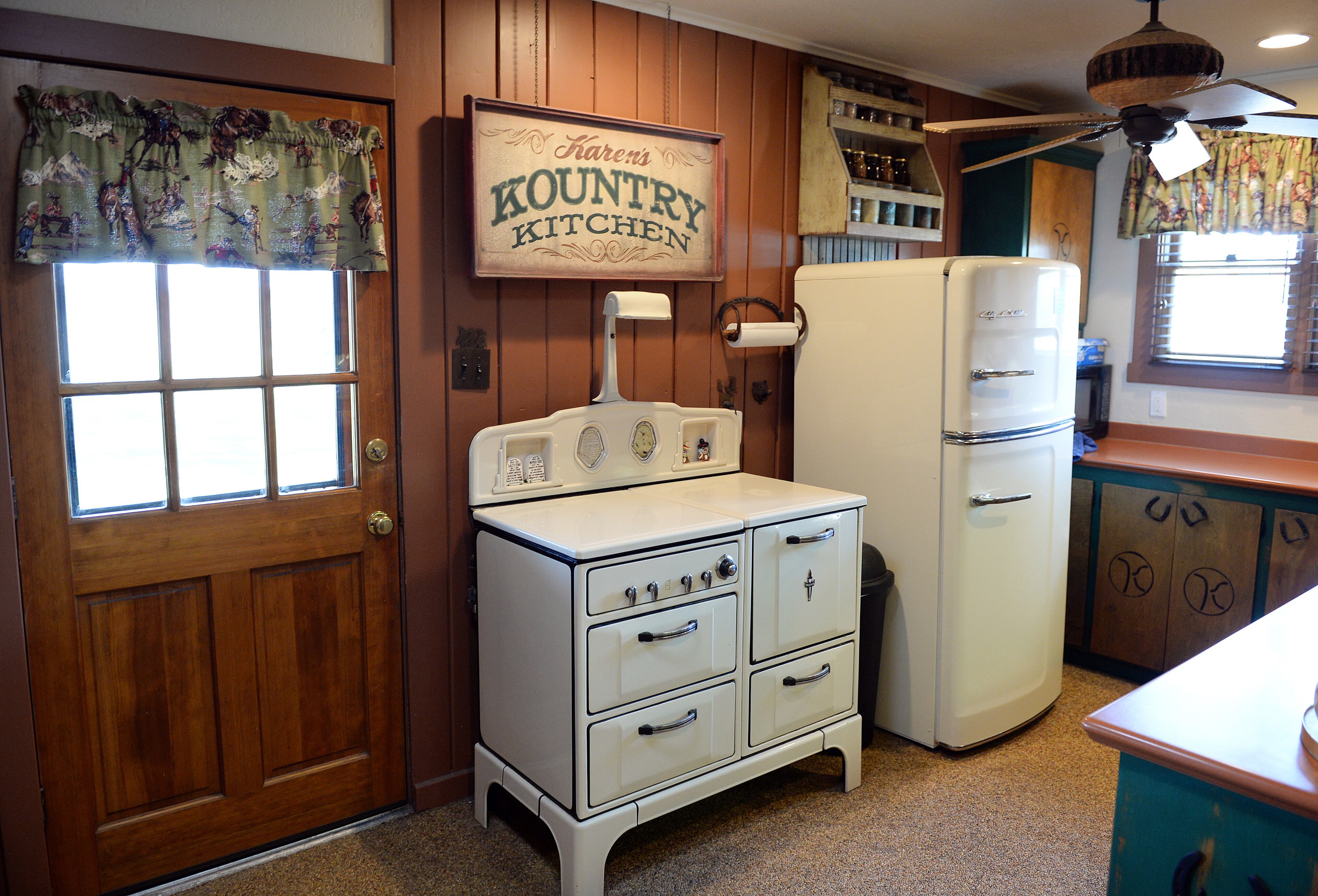 The kitchen at Karen Perez's Hanford home features old time appliances while carrying a western theme as it does throughout the home, as seen on Wednesday, Sept. 27, 2017. (Craig Kohlruss/Fresno Bee/TNS)
