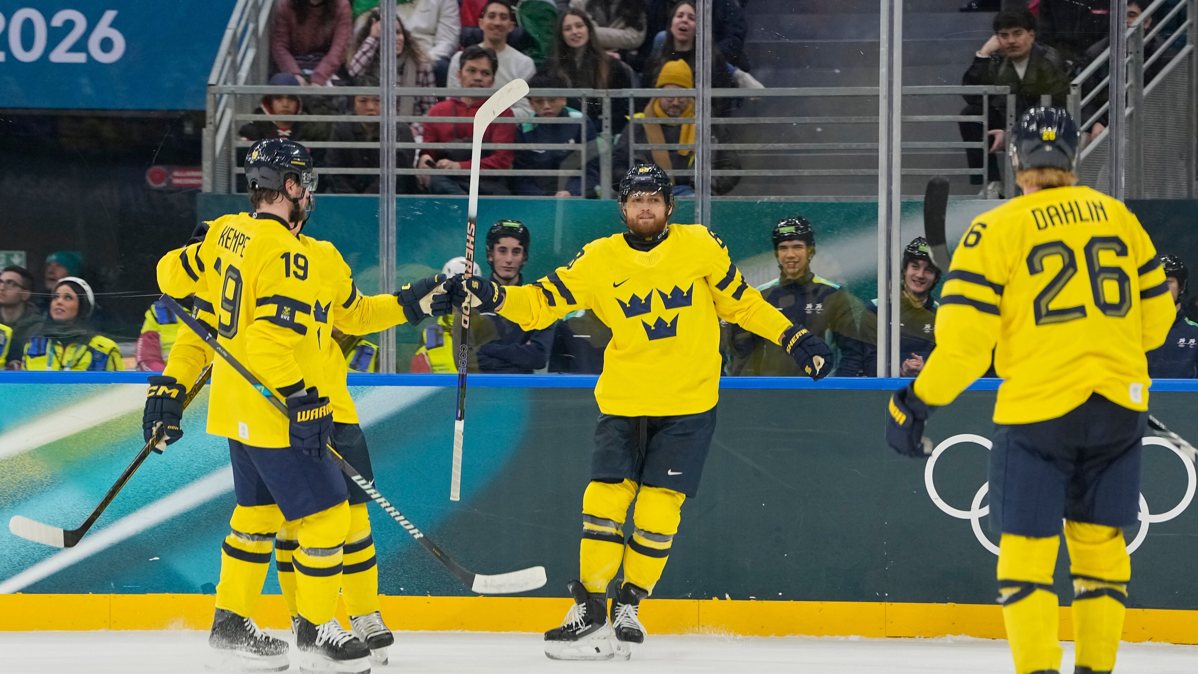 Sweden's William Nylander, center, celebrates after scoring her side's third goal during a preliminary round match of men's ice hockey between Italy and Sweden at the 2026 Winter Olympics, in Milan, Italy, Wednesday, Feb. 11, 2026. (AP Photo/Hassan Ammar)