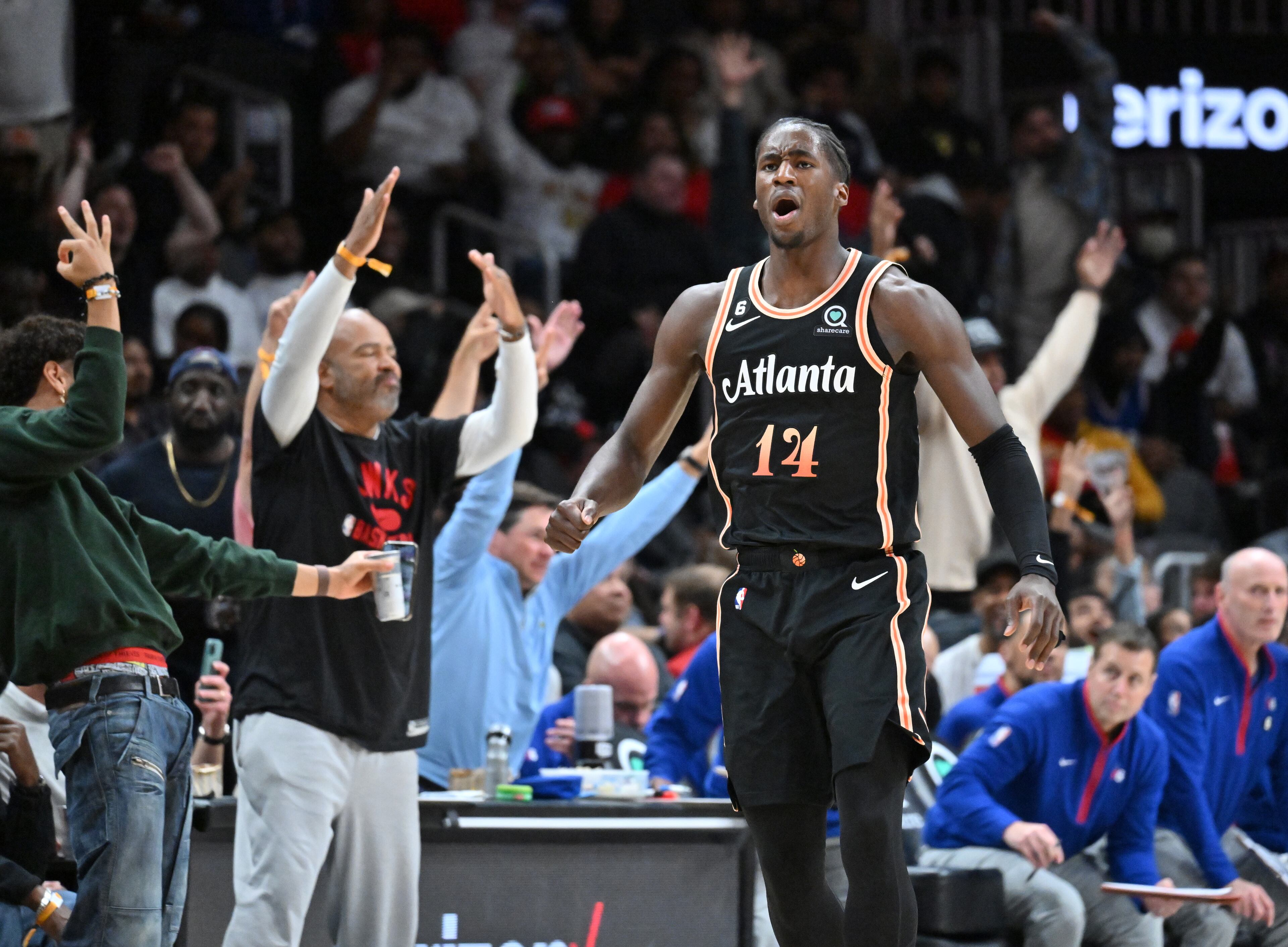 Hawks' AJ Griffin (14) celebrates after scoring during the second half. (Hyosub Shin / Hyosub.Shin@ajc.com)