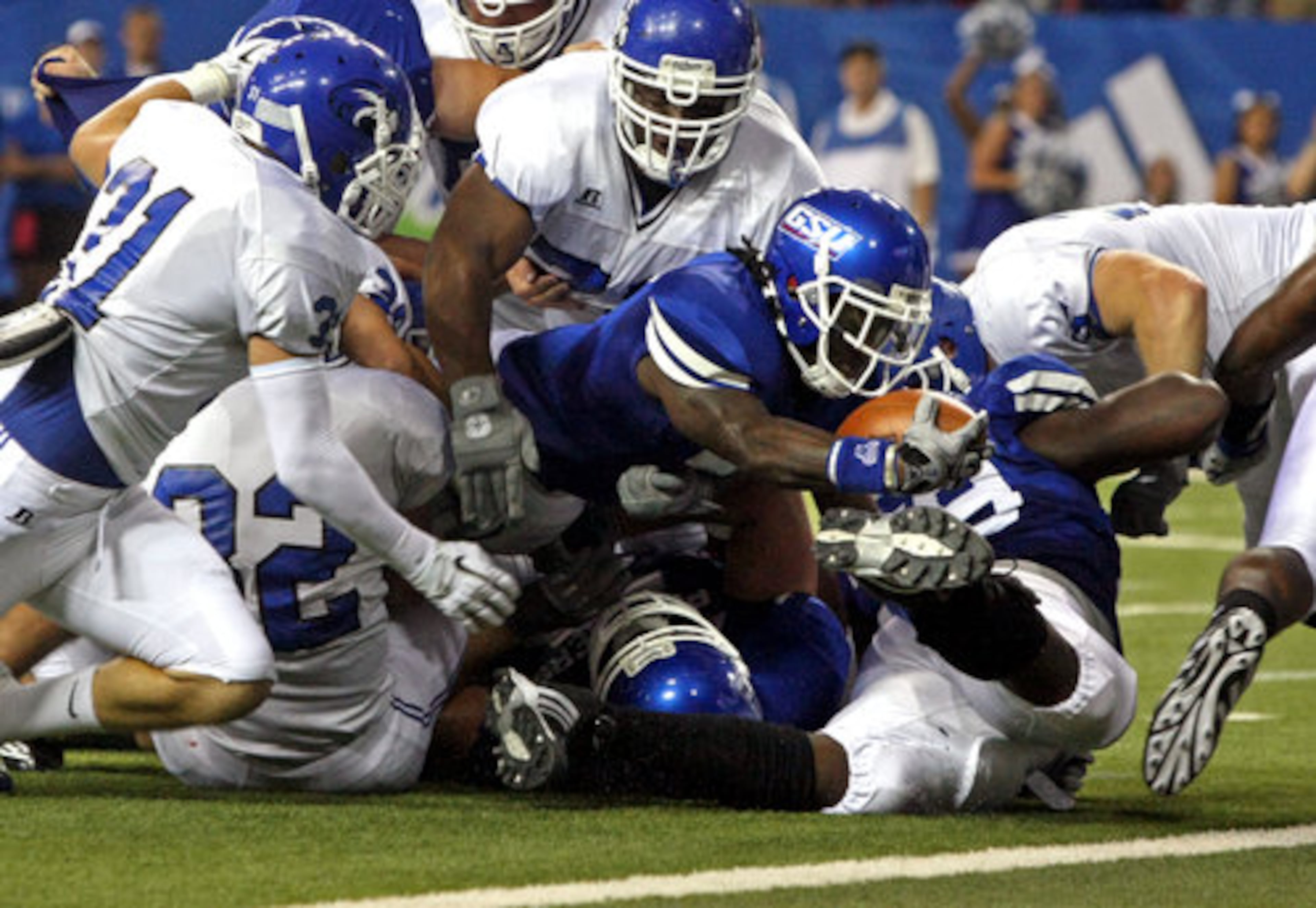 GSU running back Parris Lee (7) scores GSU's first ever touchdown on a 4-yard run in the first quarter of their game against Shorter College in the Georgia Dome Thursday night in Atlanta, Ga., Sept. 2, 2010.