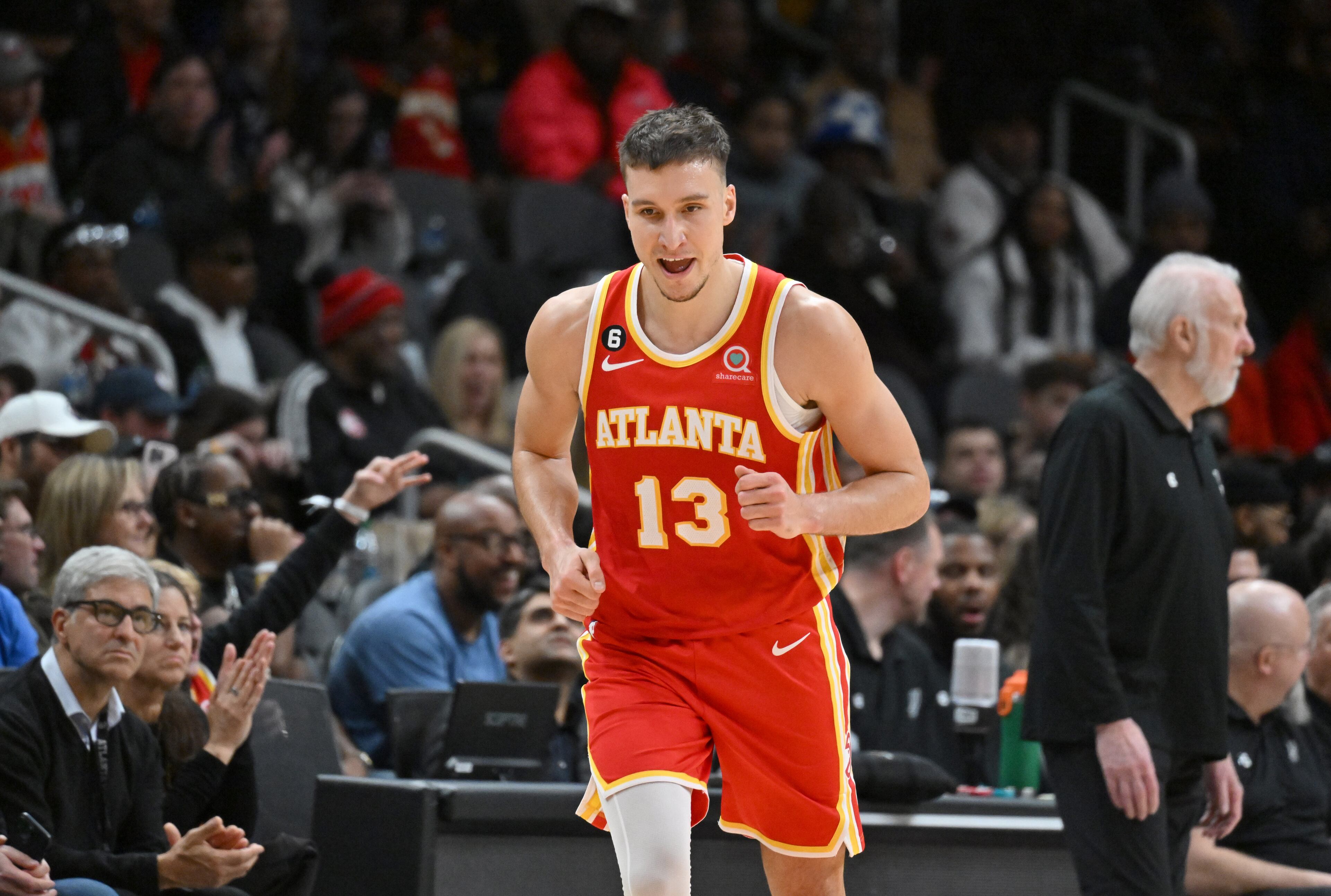 Atlanta Hawks' guard Bogdan Bogdanovic (13) celebrates after scoring a 3-point basket during the second half in an NBA basketball game at State Farm Arena, Saturday, Feb. 11, 2023, in Atlanta. Atlanta Hawks won 125-106 over San Antonio Spurs. (Hyosub Shin / Hyosub.Shin@ajc.com)