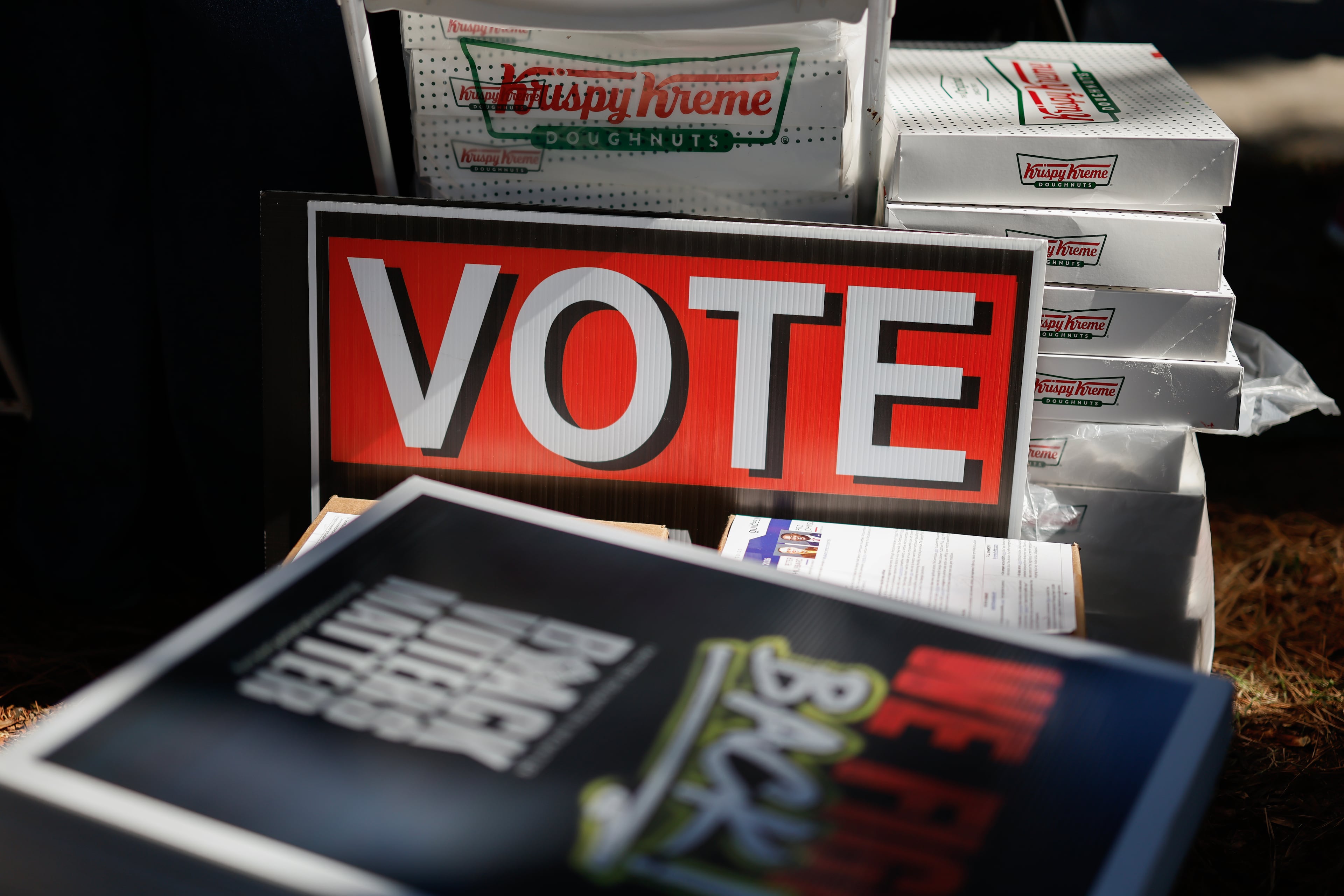 Election materials and doughnuts are given away during a “No Kings: Vote Early Atlanta” event at the C.T. Martin Natatorium and Recreation Center, a Fulton County early voting location, on Saturday, Oct. 17, 2026, in Atlanta. (Erik S. Lesser for the AJC)
