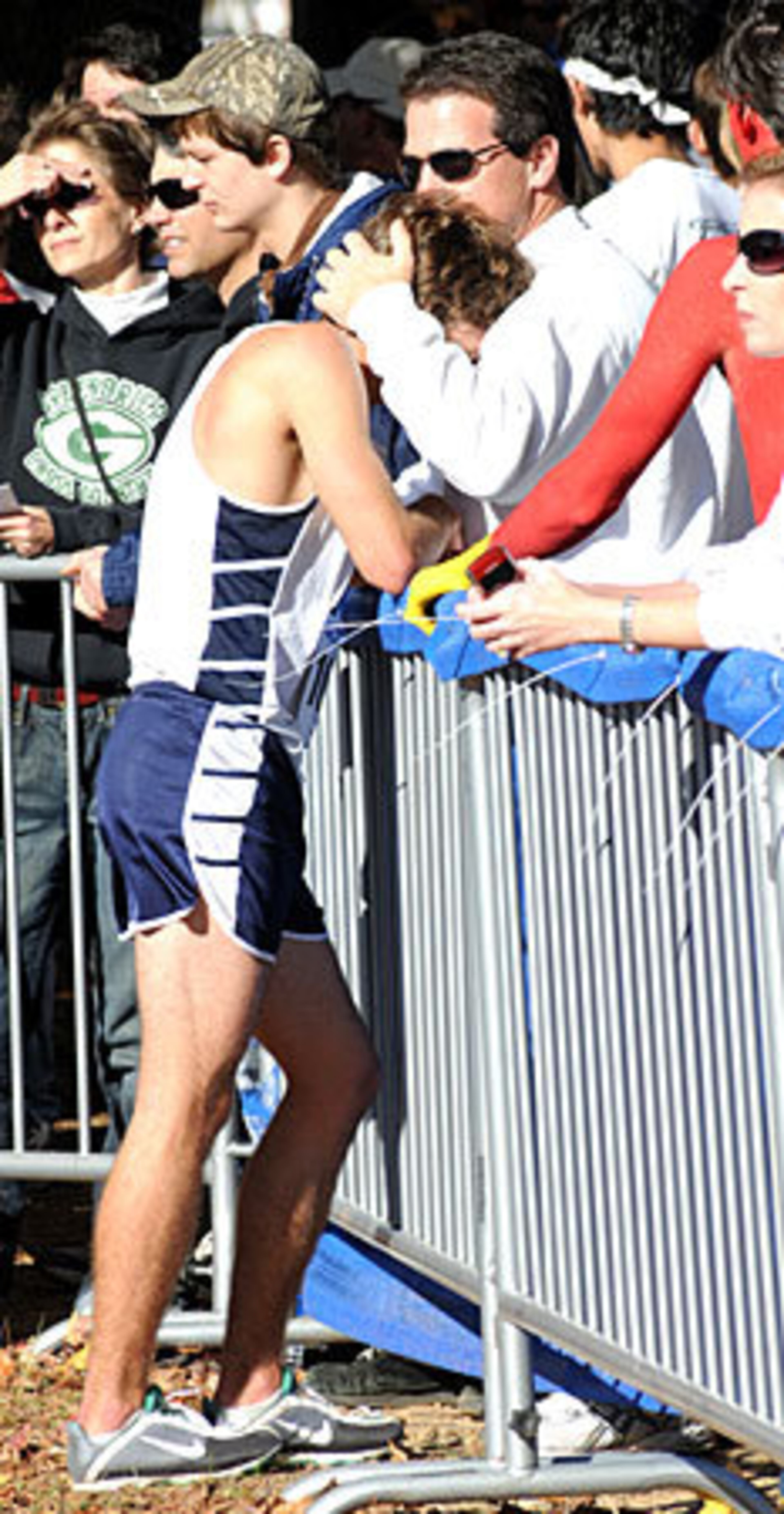 Northview's Spencer Carter, unhappy with his finish, is comforted by father Jon at the finish.