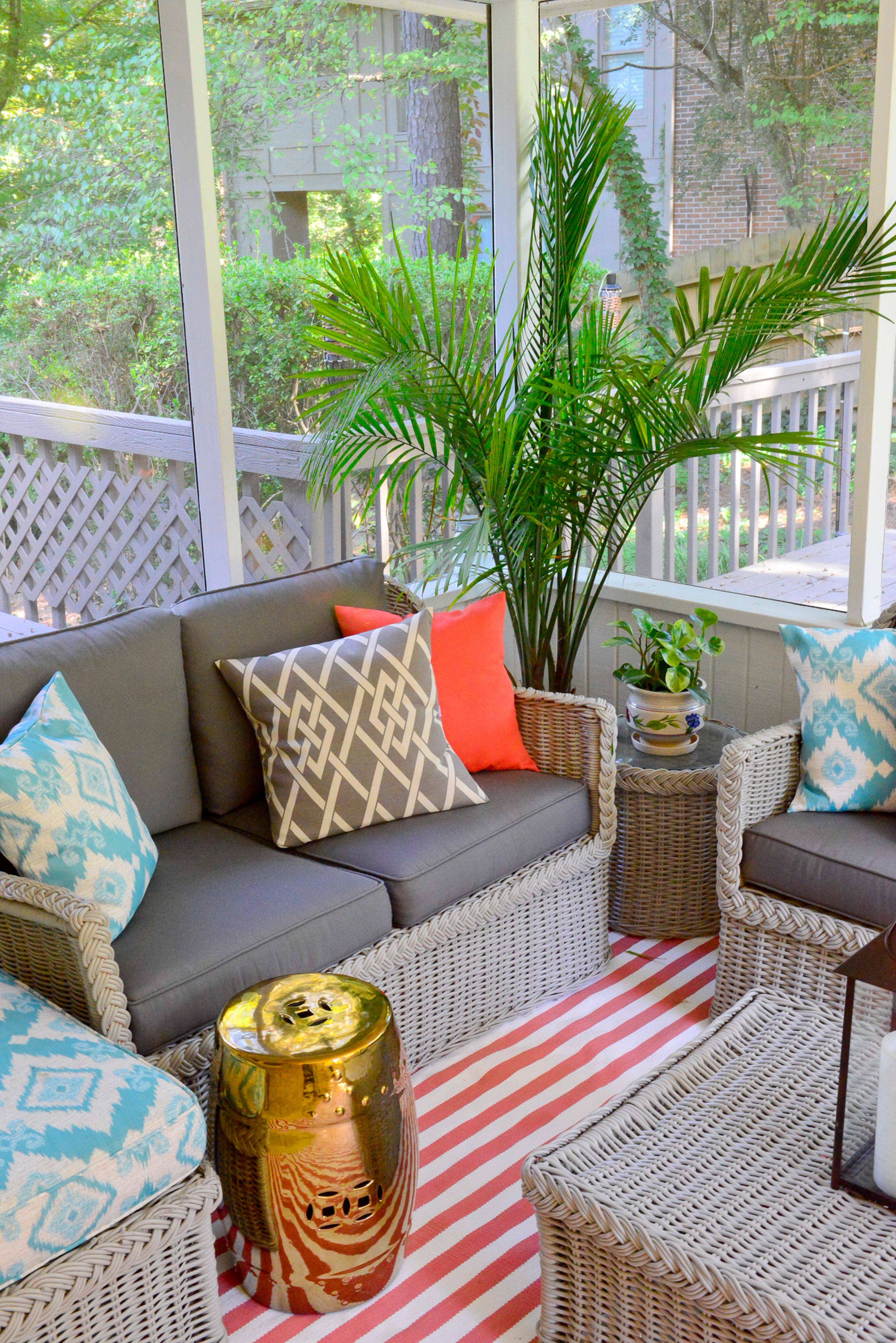 A striped Dash & Albert rug was the biggest new addition to the screened porch, after the previous homeowners left their wicker furniture.