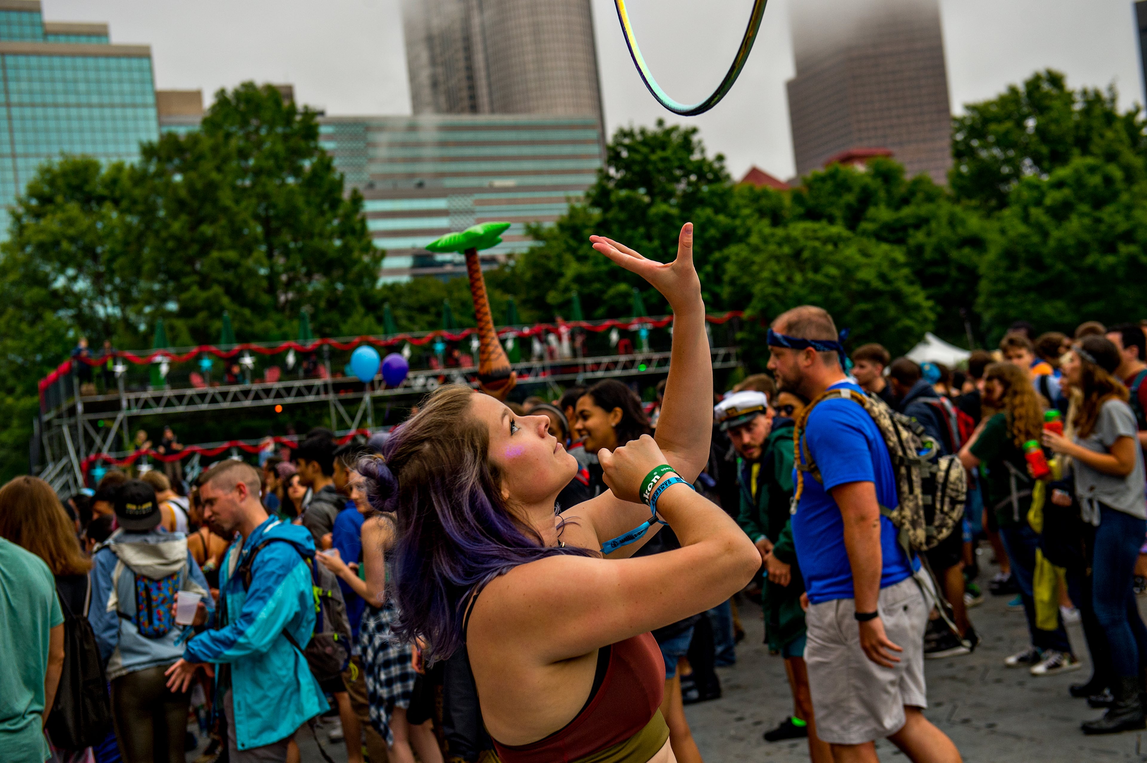 Halina Wilusz (left) tosses her hula hoop into the air as she dances during the first night of the Shaky Beats Music Festival at Centennial Olympic Park in Atlanta on Friday, May 20, 2016. JONATHAN PHILLIPS / SPECIAL