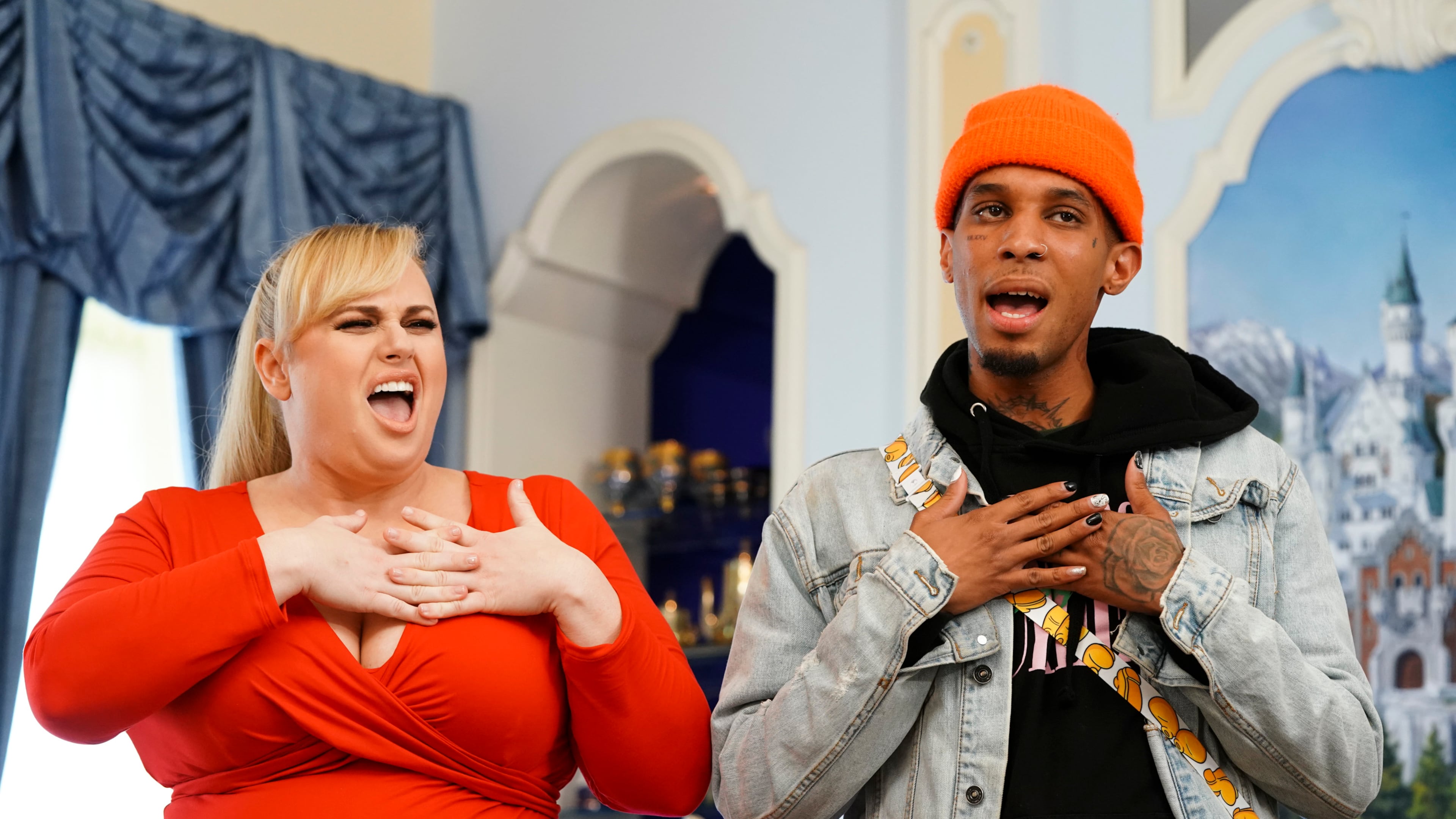 AMERICAN IDOL - "214 (Disney Night)" - "American Idol"'s Top 10 contestants head to The Happiest Place On Earth, Disneyland Park in Anaheim, California, to prepare for the next phase of the competition, Disney Night. The finalists will be joined by celebrity mentor Rebel Wilson, who will offer up her pitch-perfect expertise as the superstar hopefuls prepare for their Disney-themed performances. All-star judges Katy Perry, Luke Bryan and Lionel Richie will perform a timeless Disney song in Disneyland Park's Fantasyland. The Top 10 will then return to the iconic Idol stage in Los Angeles to perform fan-favorite Disney songs, in hopes of winning America's heart and vote for a spot in the Top 8. Joining the Top 10 to perform the beloved song "Part of Your World" from Disney's "The Little Mermaid" is singer and actress Lea Michele. Also, America's sweethearts, ABC's Season 1 "American Idol" winner, Maddie Poppe, and runner-up Caleb Lee Hutchinson, return to the stage to sing a Disney classic during a special duet performance. The magic takes place SUNDAY, APRIL 21 (8:00-10:01 p.m. EDT/5:00-7:01 p.m. PDT), on The ABC Television Network. (ABC/Eric McCandless) REBEL WILSON, DIMITRIUS GRAHAM