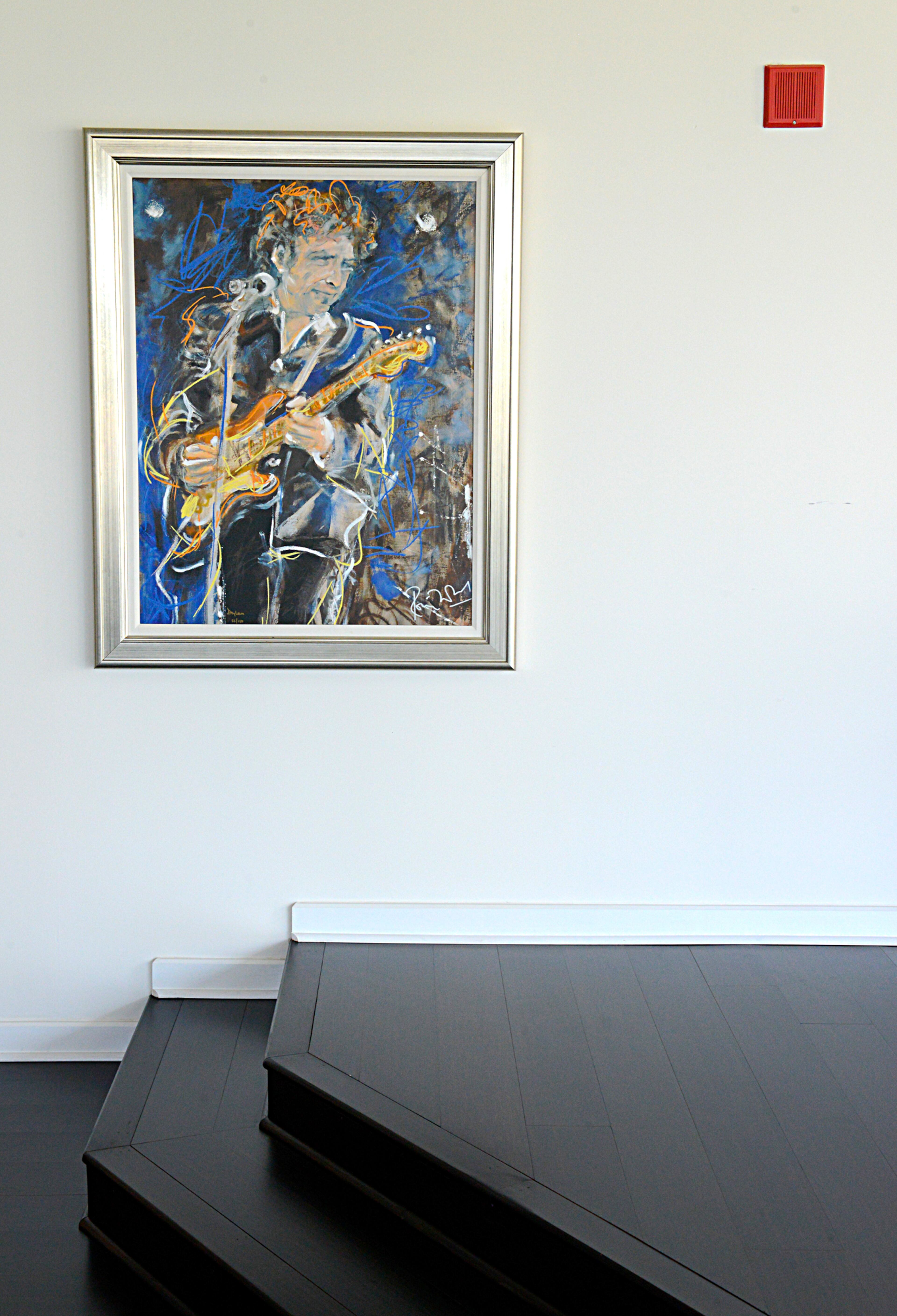 The home of David and Cindi Oakey is infused with art and rock and roll. In their upstairs loft, their two passions meet in this "ginormous" portrait of Bob Dylan by Rolling Stones guitarist and British artist Ronnie Wood.