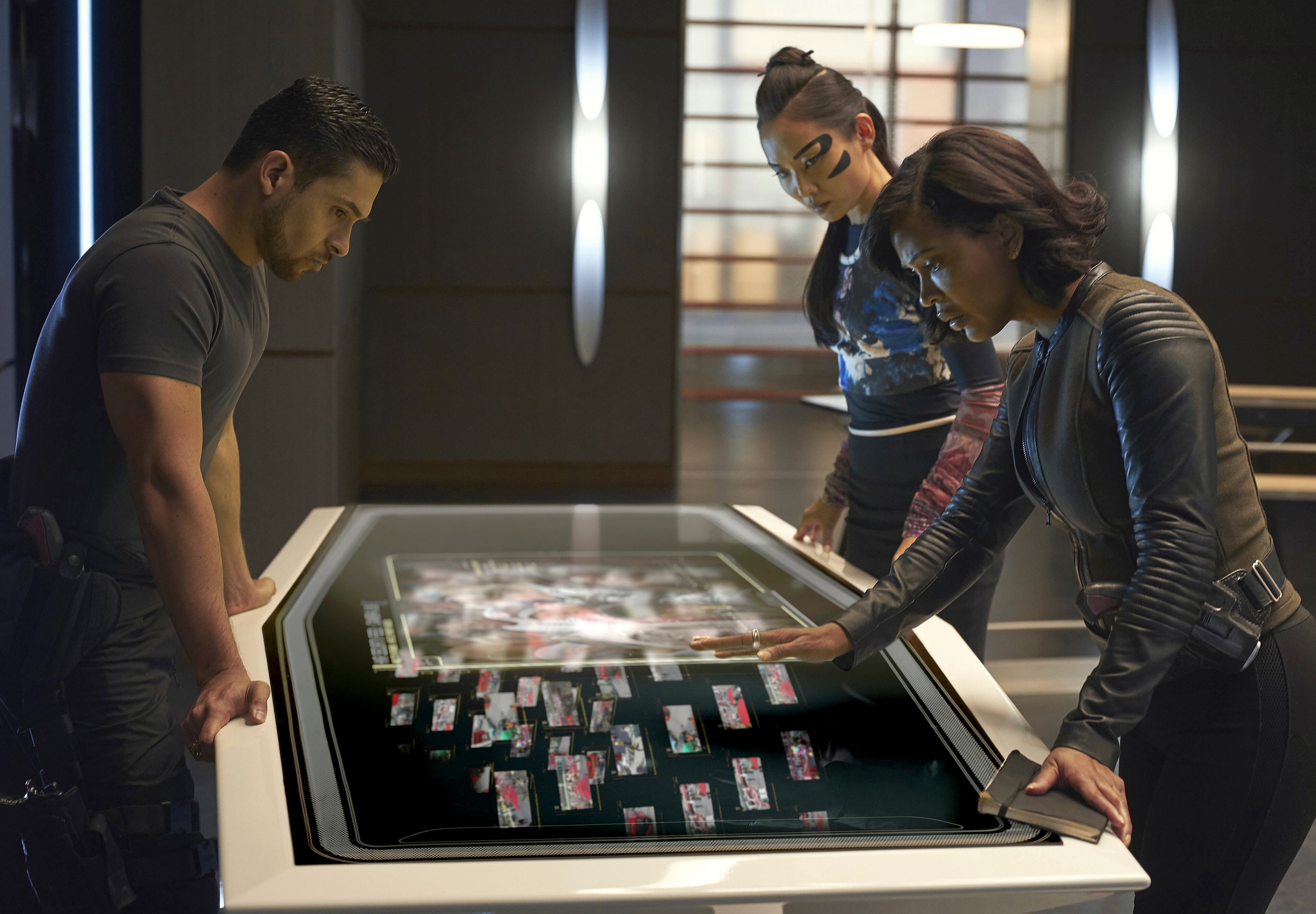 In this image released by Fox, Wilmer Valderrama, from left, Li Jun LI and Meagan Good appear in a scene from "Minority Report," premiering Monday, Sept. 21 at 9:00 EDT on Fox. (Bruce MacCauley/Fox via AP)