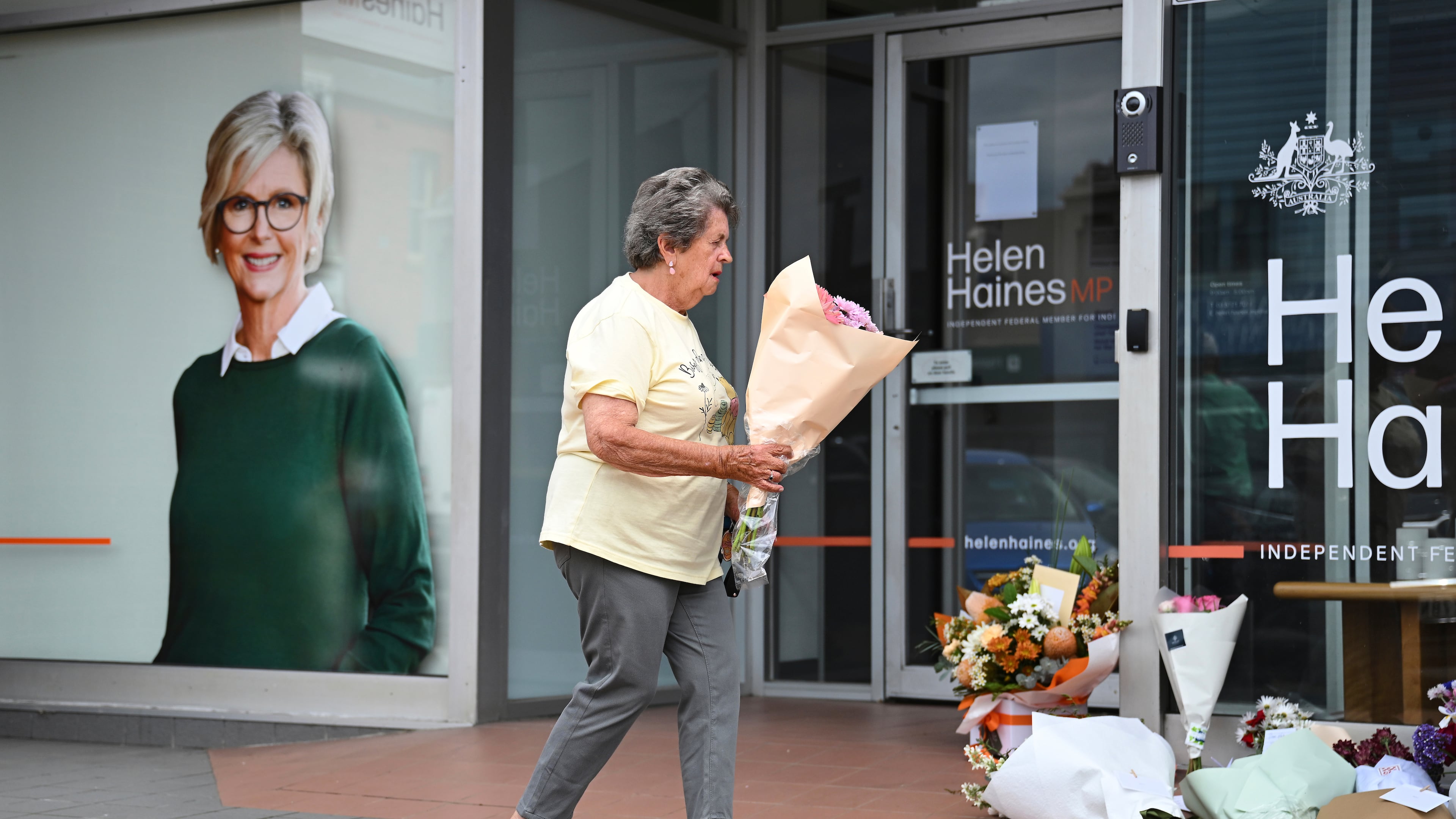 A woman delivers flowers at the electoral office of independent member of parliament, Helen Haines, in Wangaratta, Australia, Tuesday, Oct. 20, 2026. (James Ross/AAP Image via AP)