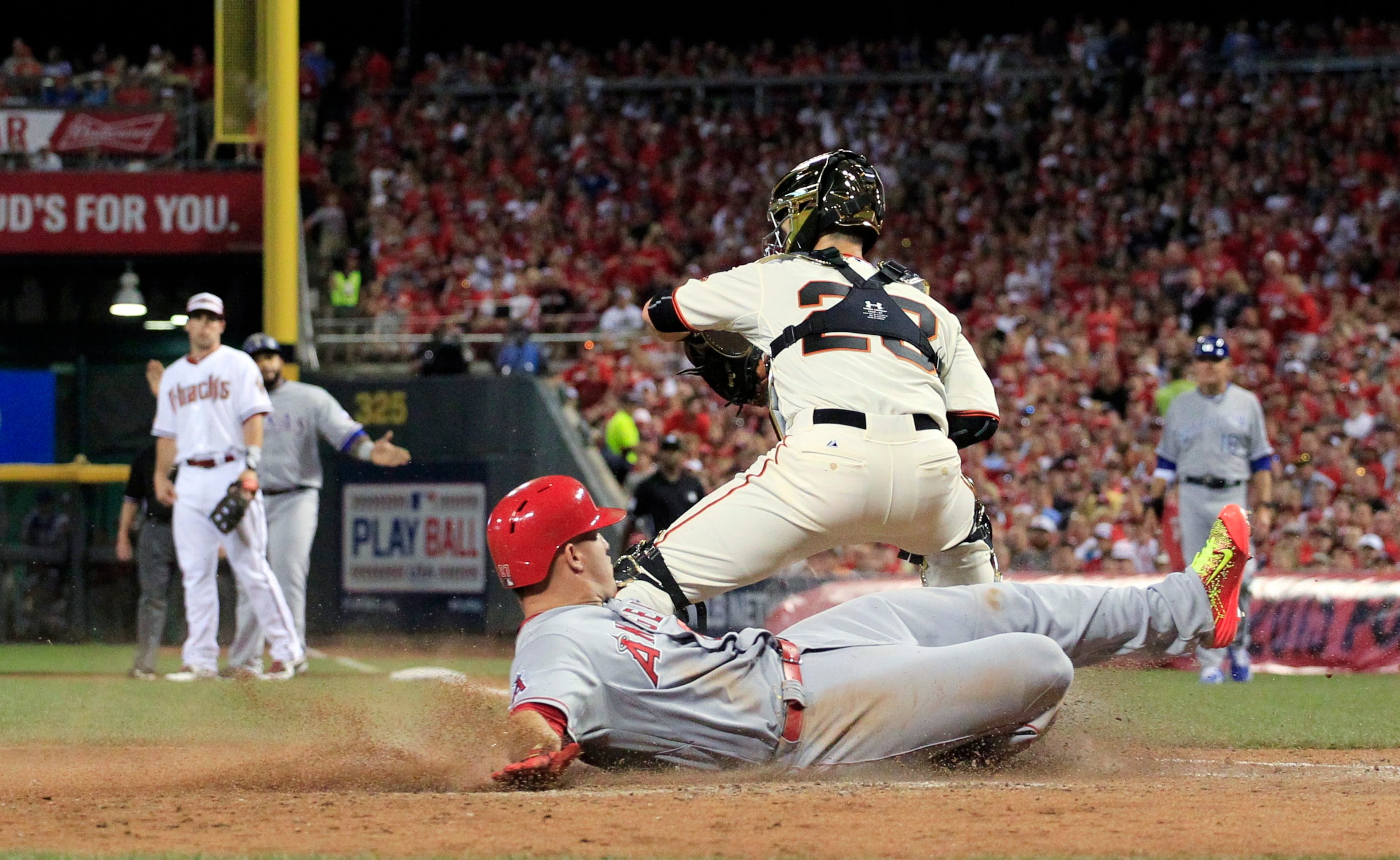 American League's Mike Trout, of the Los Angeles Angels, scores on a hit by American League's Prince Fielder, of the Texas Rangers, during the fifth inning of the MLB All-Star baseball game, Tuesday, July 14, 2015, in Cincinnati. (AP Photo/Jeff Roberson)