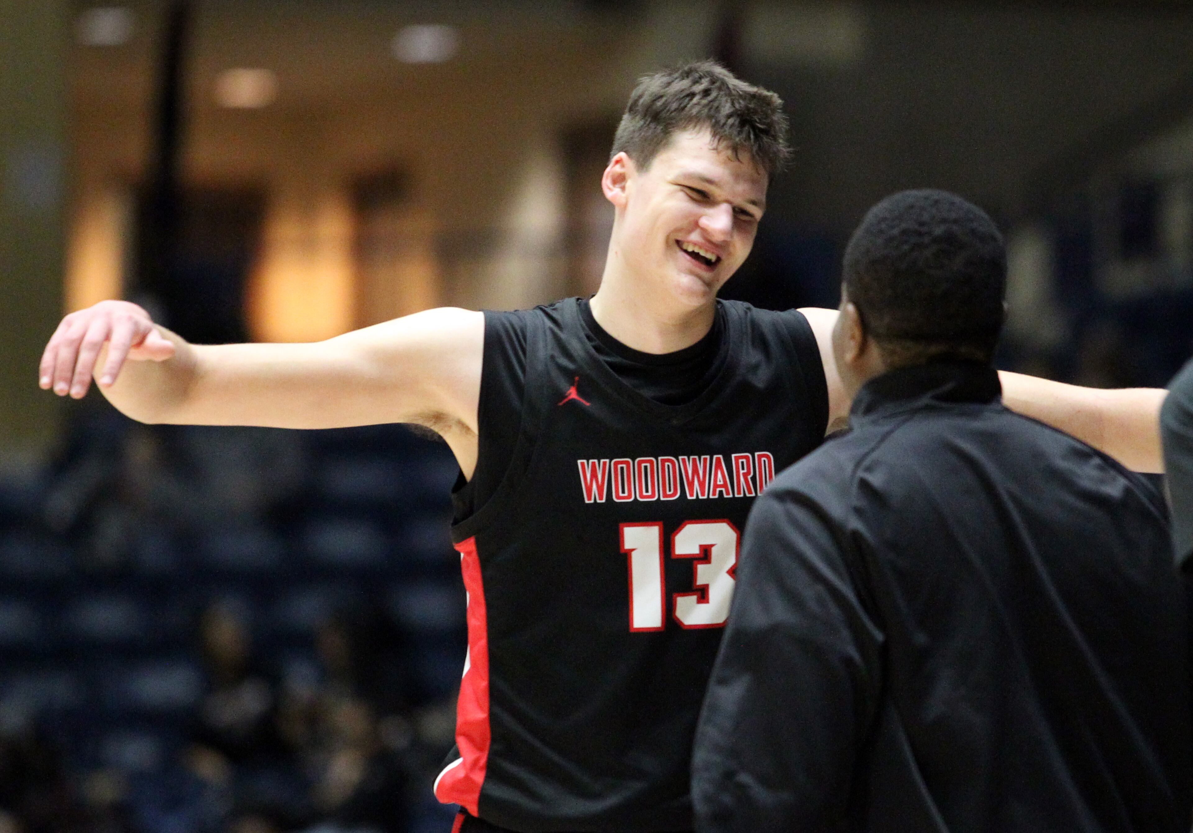 Woodward Academy's Walker Kessler (13) celebrates with his coach after their win over Cross Creek of the Class AAAA boys title basketball game at the Macon Centreplex, Friday March 6, 2020, in Macon. Tami Chappell for the Atlanta Journal Constitution