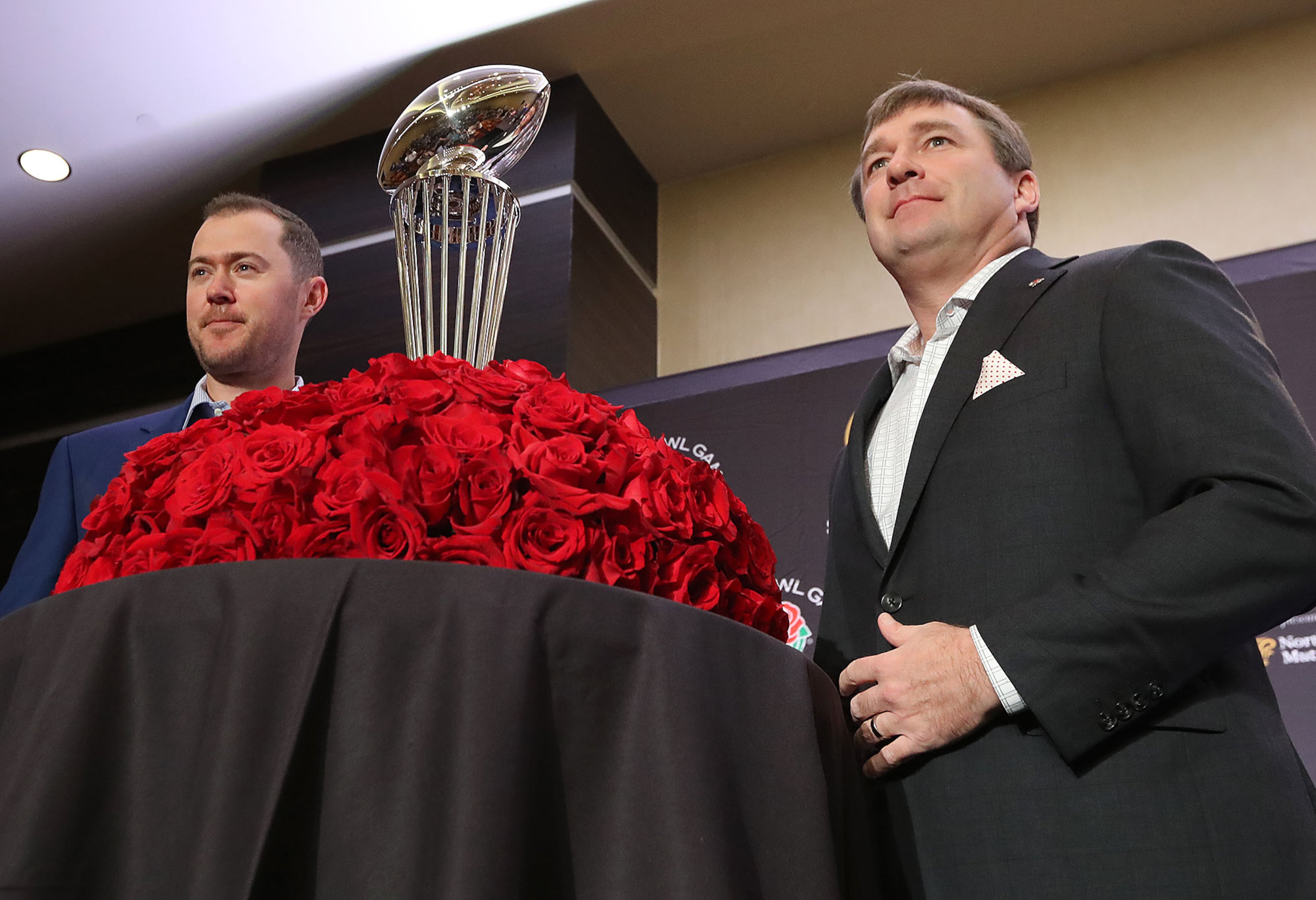 December 31, 2017 Los Angeles: Georgia head coach Kirby Smart and Oklahoma head coach Lincoln Riley stand with the Rose Bowl trophy at the conclusion of the head coach press conference on Sunday, December 31, 2017, in Los Angeles. Curtis Compton/ccompton@ajc.com