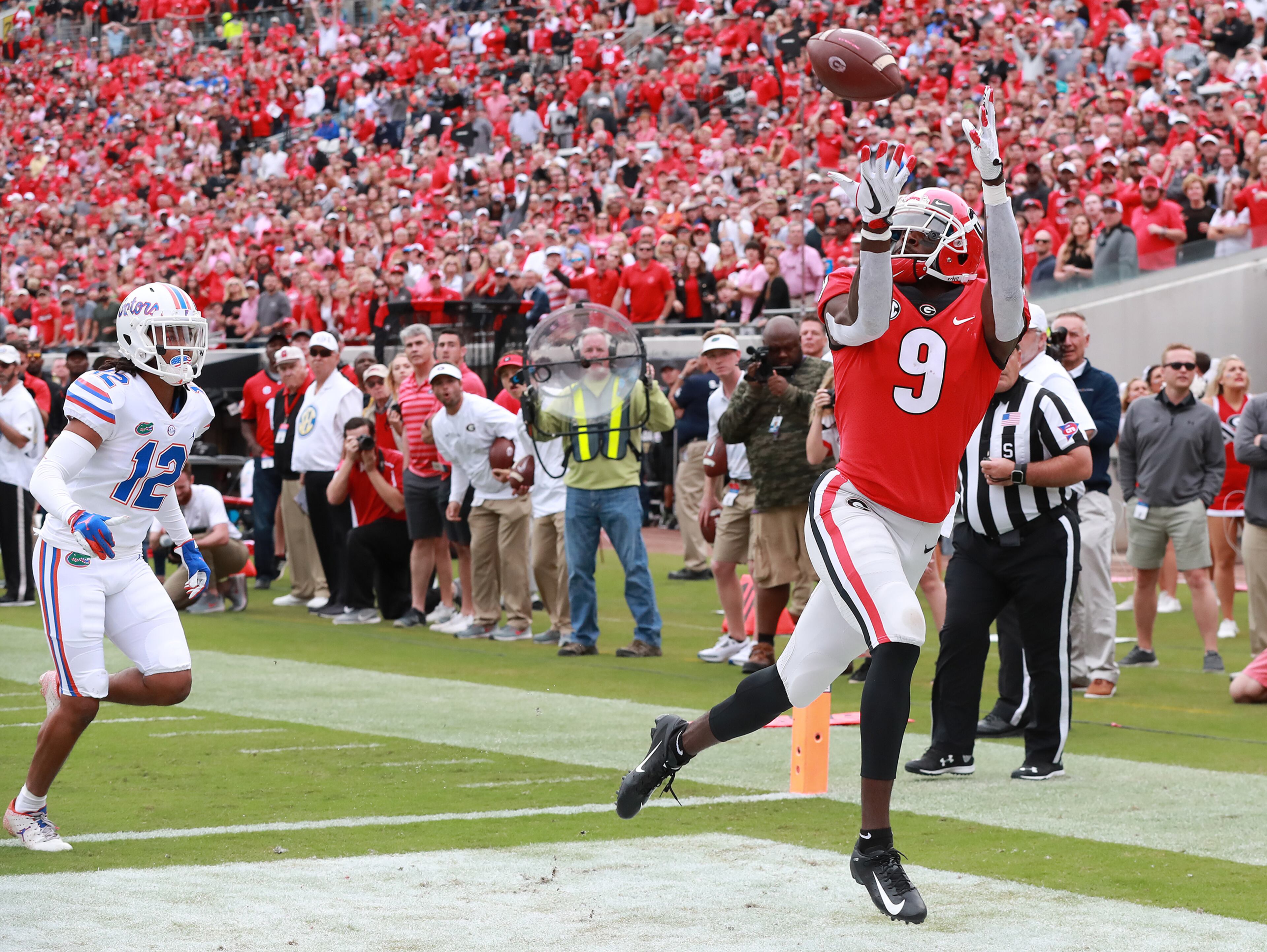 October 27, 2018 Jacksonville: Georgia wide receiver Jeremiah Holloman gets past Florida defensive back C.J. McWilliams for a touchdown reception and a 10-0 lead during the first quarter in the Georgia-Florida NCAA college football game on Saturday, Oct 27, 2018, in Jacksonville. Curtis Compton/ccompton@ajc.com