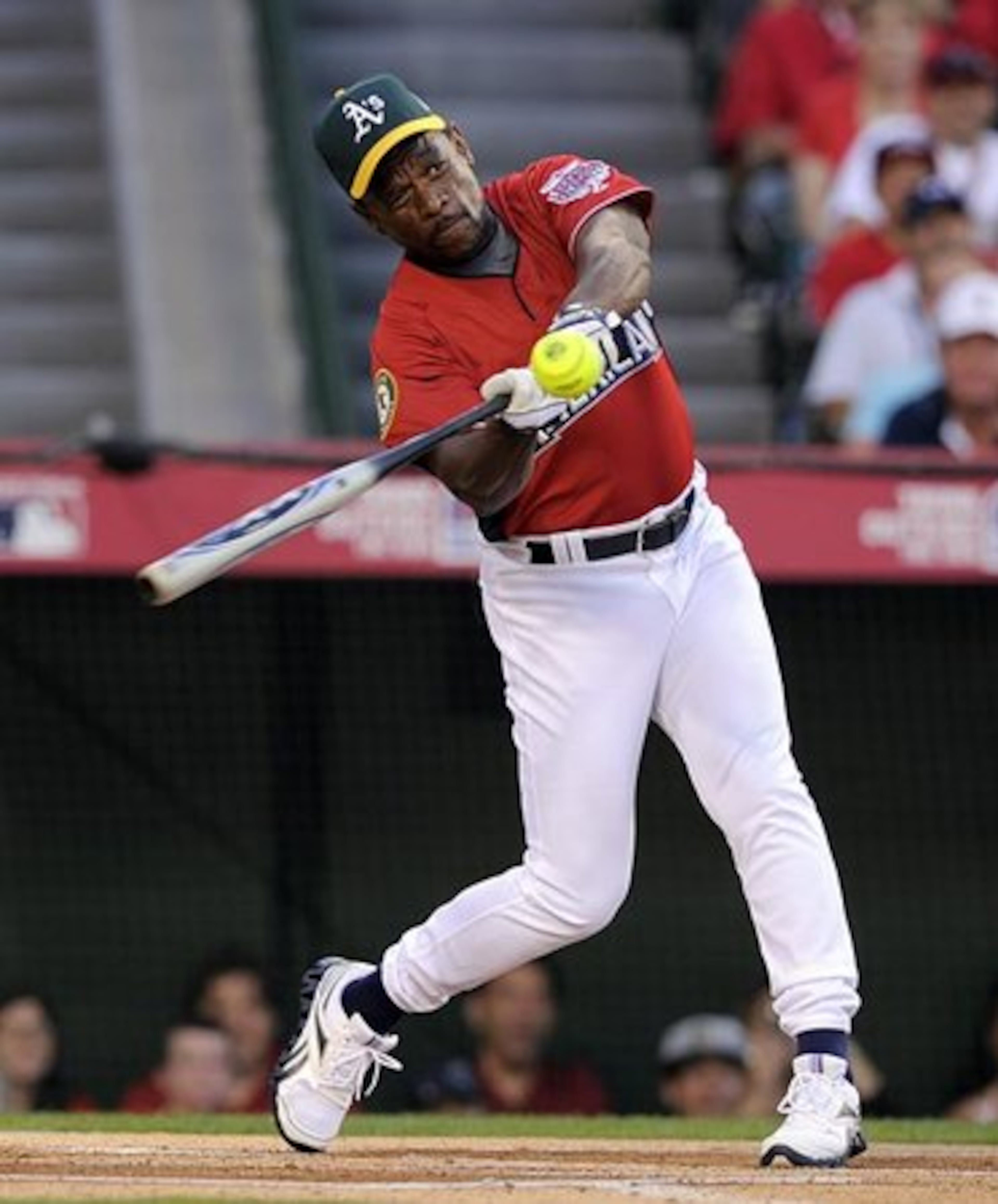 Baseball Hall of Famer Rickey Henderson hits a home run...