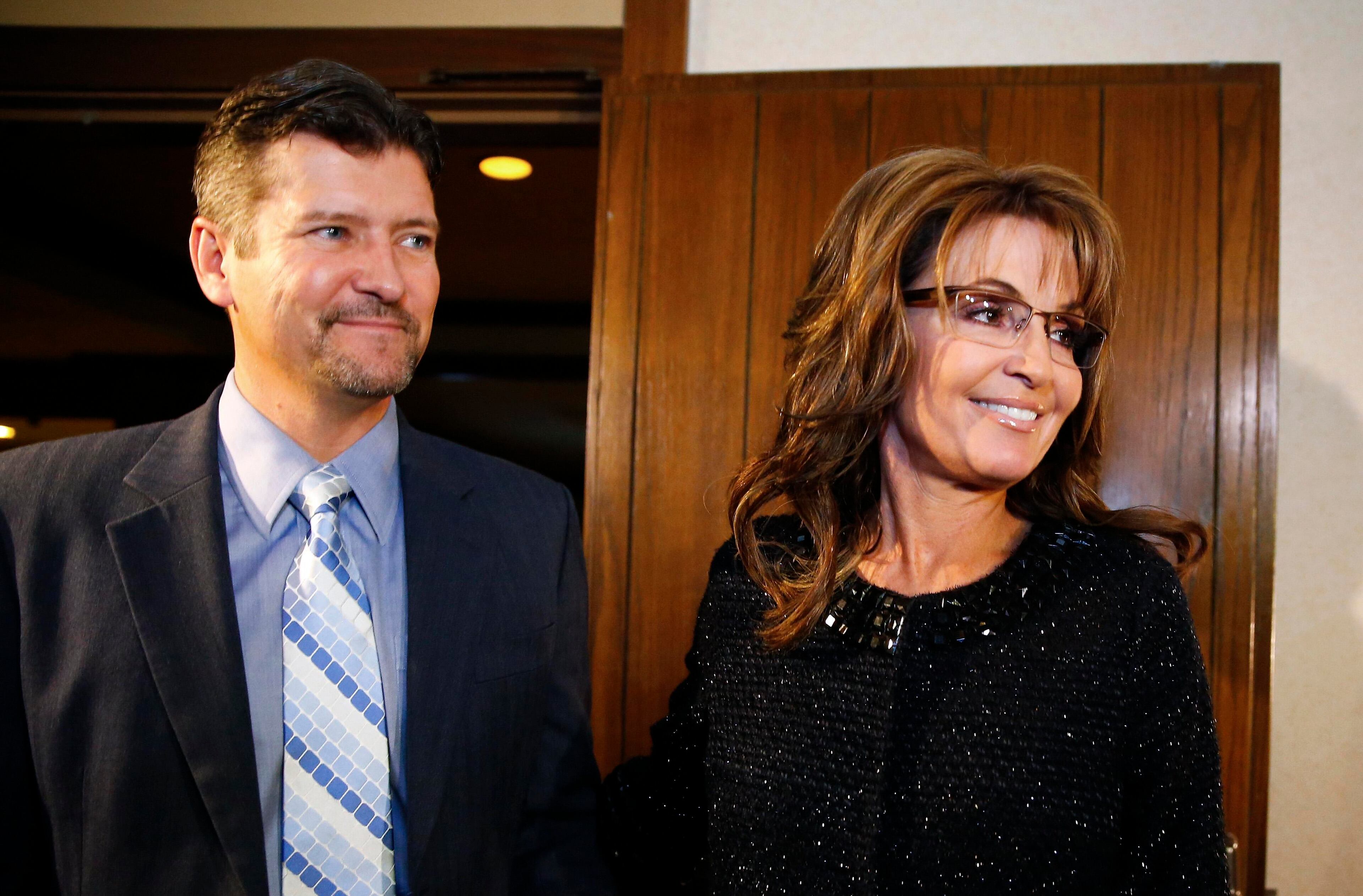 Former Republican governor of Alaska Sarah Palin and her husband Todd arrive for a celebration for evangelist Billy Graham's 95th birthday in Asheville, North Carolina November 7, 2013. REUTERS/Chris Keane