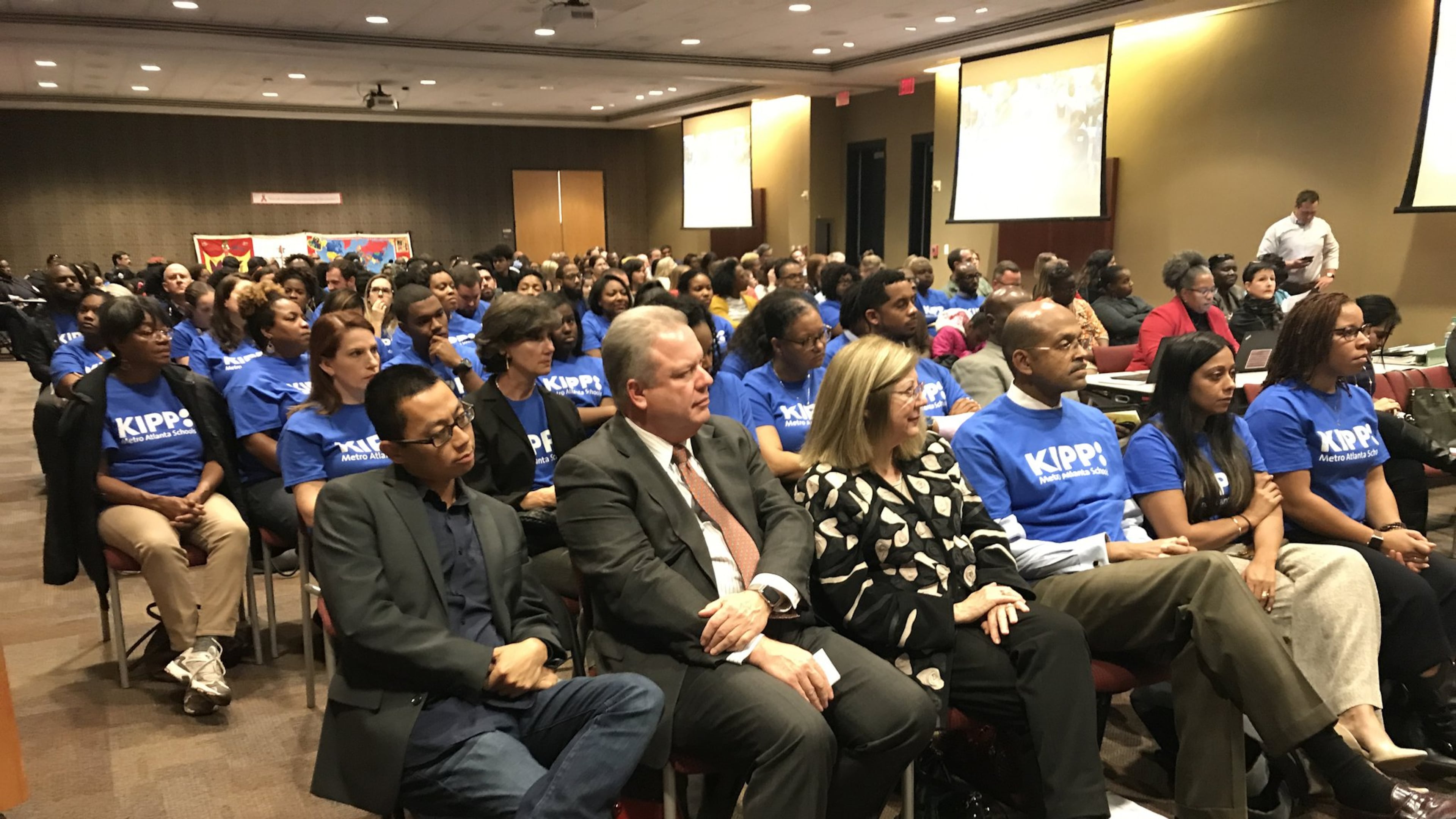 More than 50 supporters of KIPP Metro Atlanta Collaborative Inc. attend the Monday, Dec. 5, Atlanta Board of Education meeting in matching blue T-shirts to show support for the charter school operator s request to increase its enrollment cap.