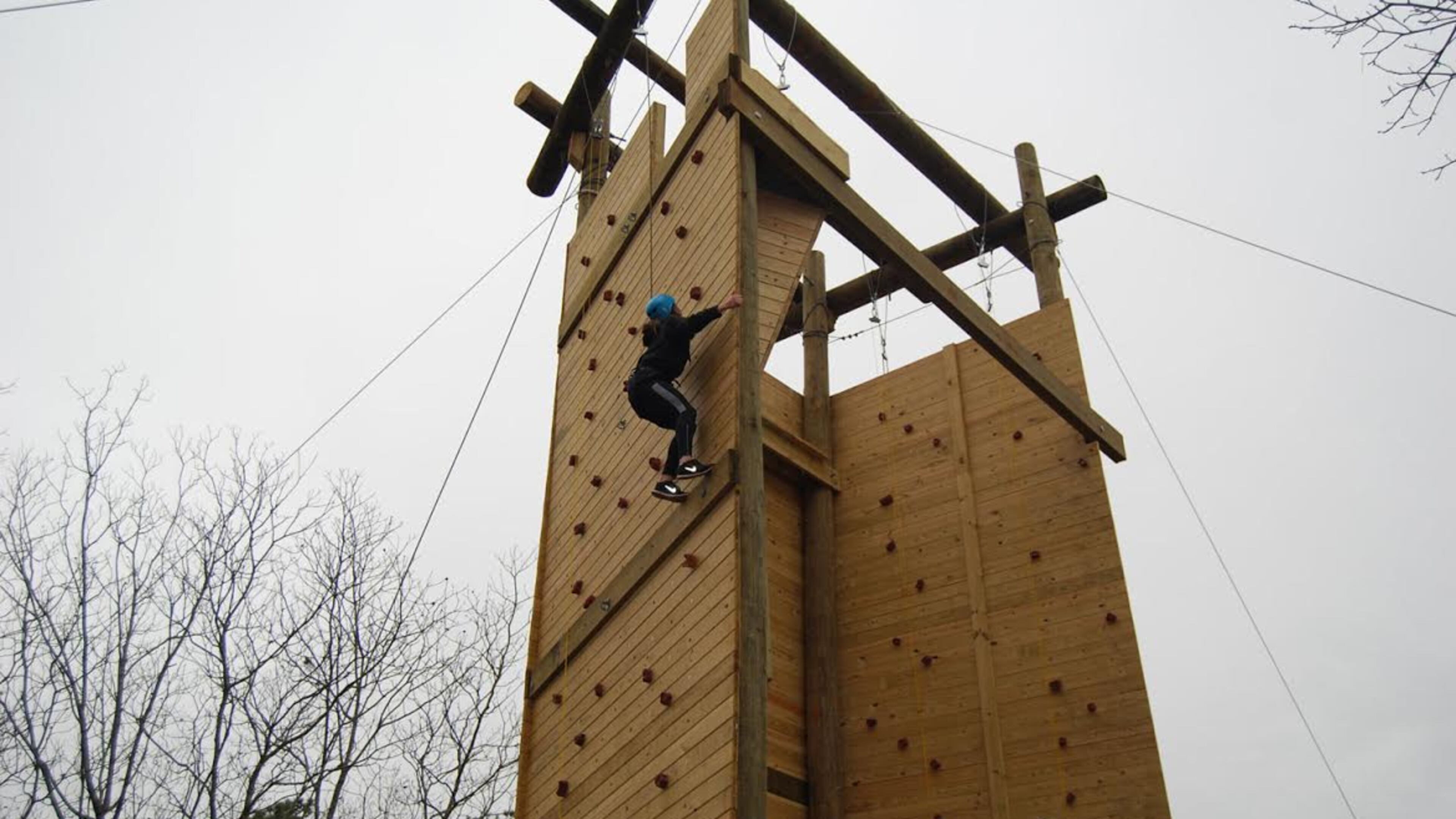 A climber ascends the new climbing tower at Sawnee Mountain Preserve.