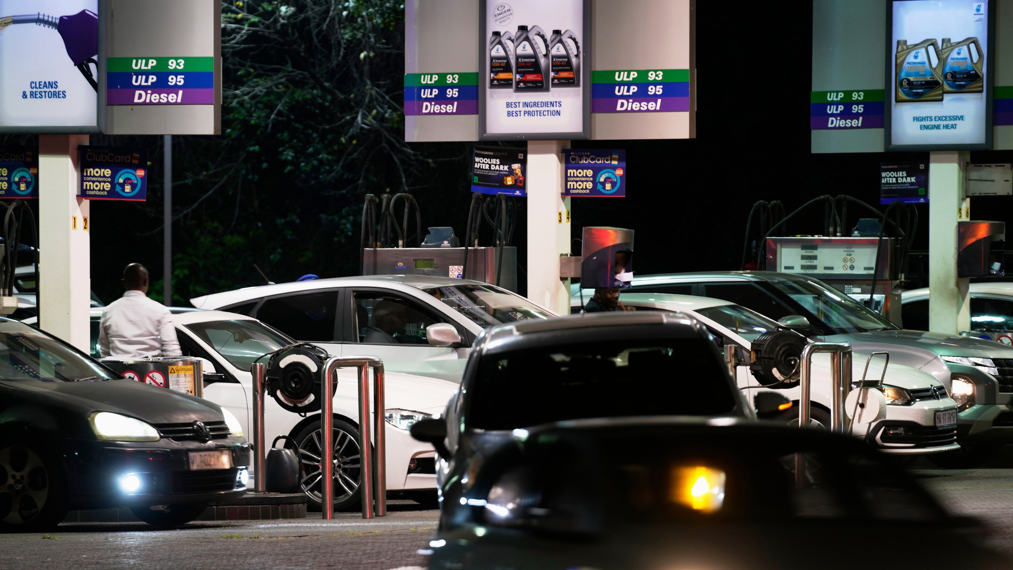 People queue to buy fuel at a petrol station, in Johannesburg, South Africa, Tuesday, March 31, 2026. (AP Photo/Themba Hadebe)