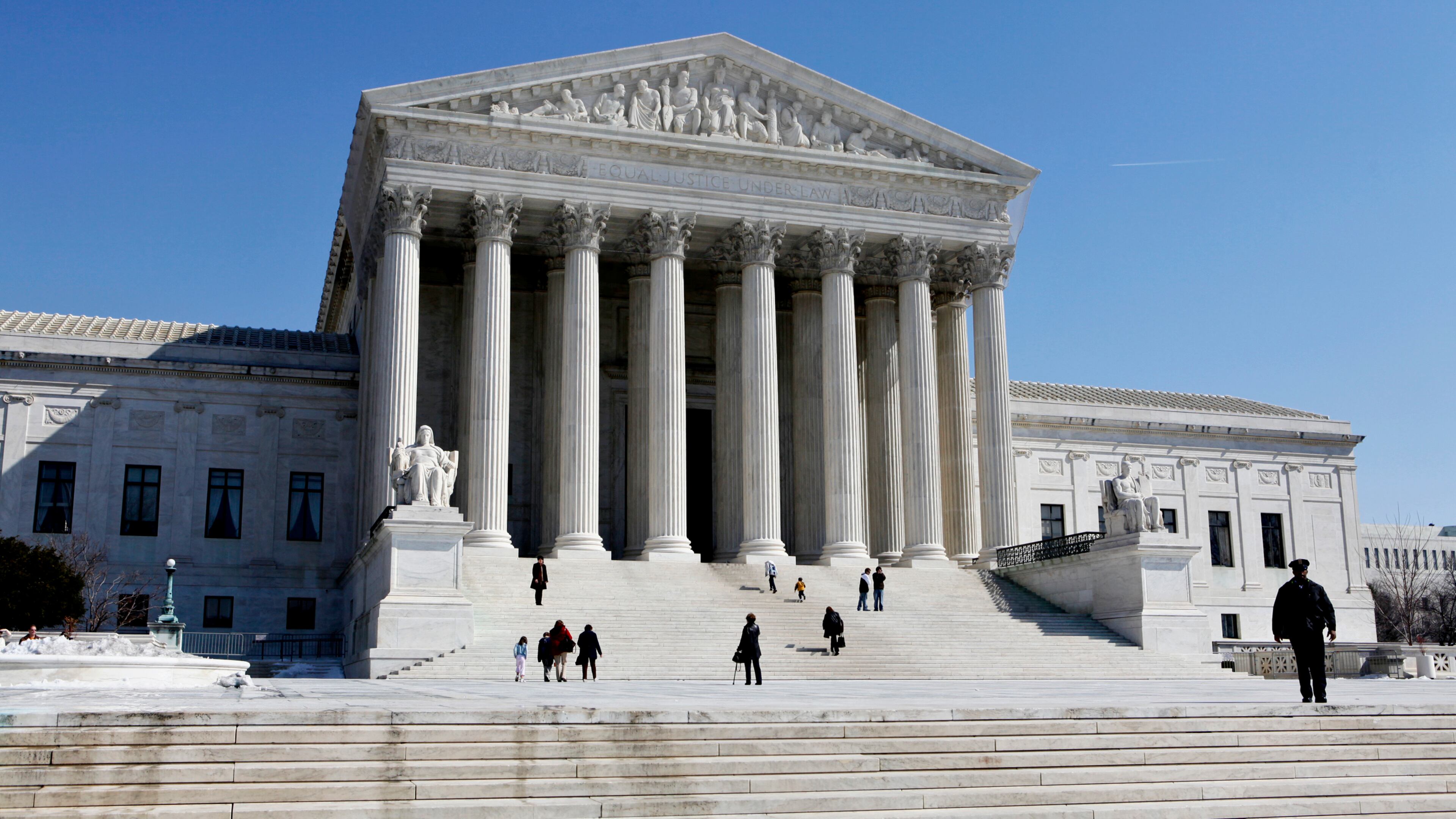 FILE- This March 5, 2009, file photo shows the U.S. Supreme Court building in Washington. The Supreme Court will struggle this week with the validity of an Arizona law that tries to keep illegal immigrants from voting by demanding all state residents show documents proving their U.S. citizenship before registering to vote in national elections. (AP Photo/J. Scott Applewhite, File)