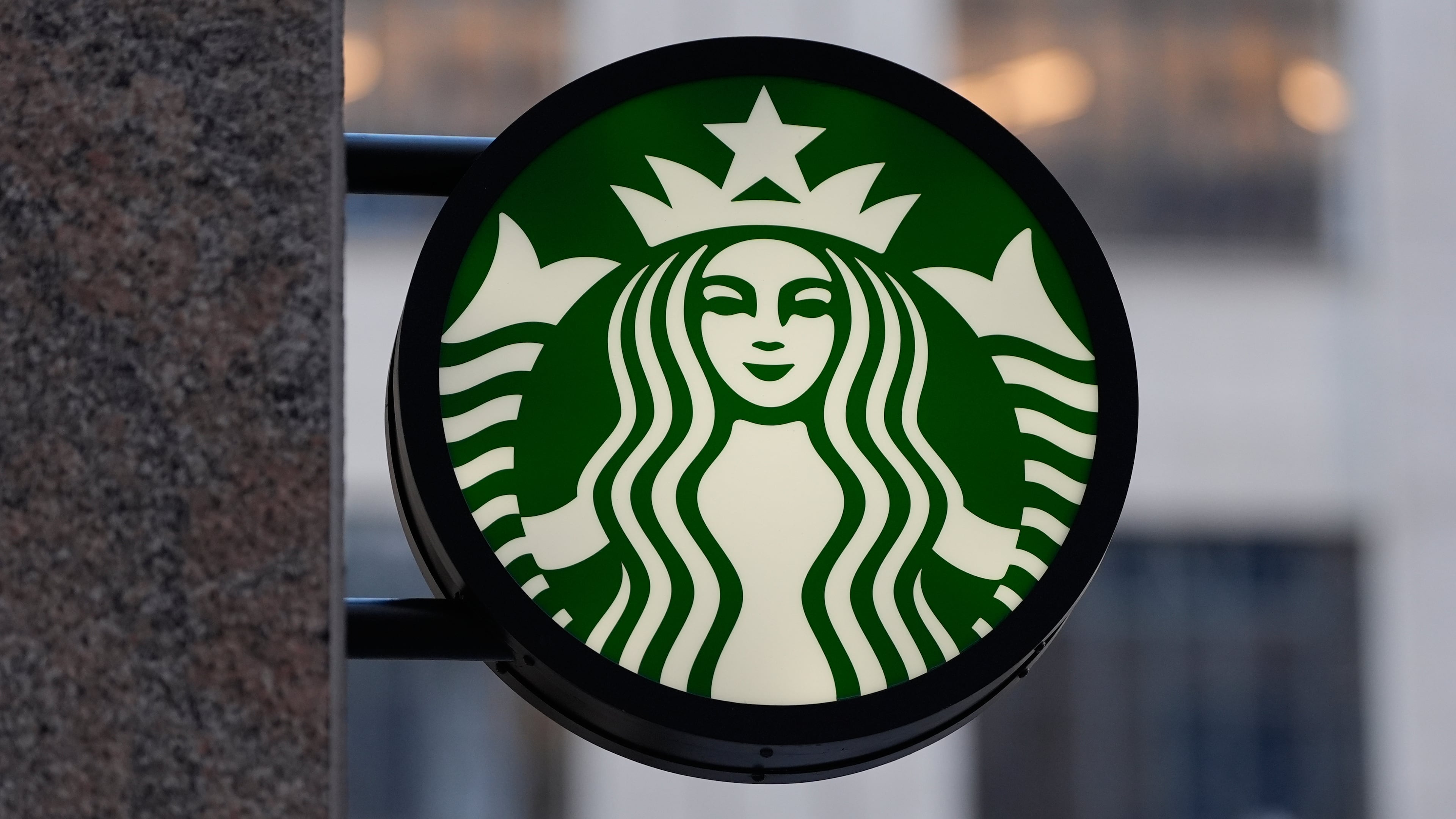 FILE - The Starbucks logo is displayed on a coffee shop, Nov. 24, 2025, in Boston. (AP Photo/Charles Krupa, File)