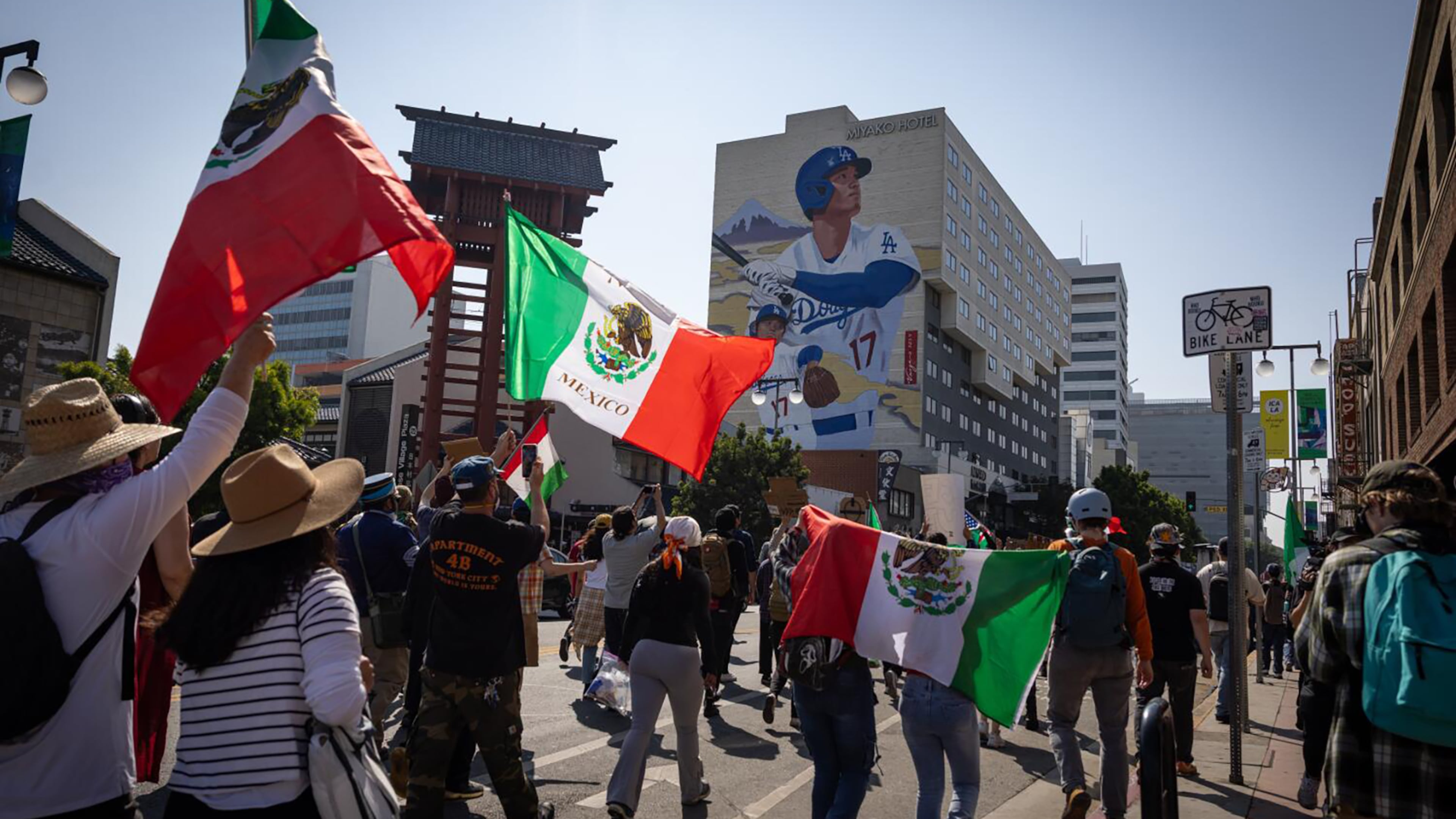 Protesters march in Little Tokyo in downtown Los Angeles due to the immigration raids in the area on Tuesday. (Jason Armond/Los Angeles Times/TNS)