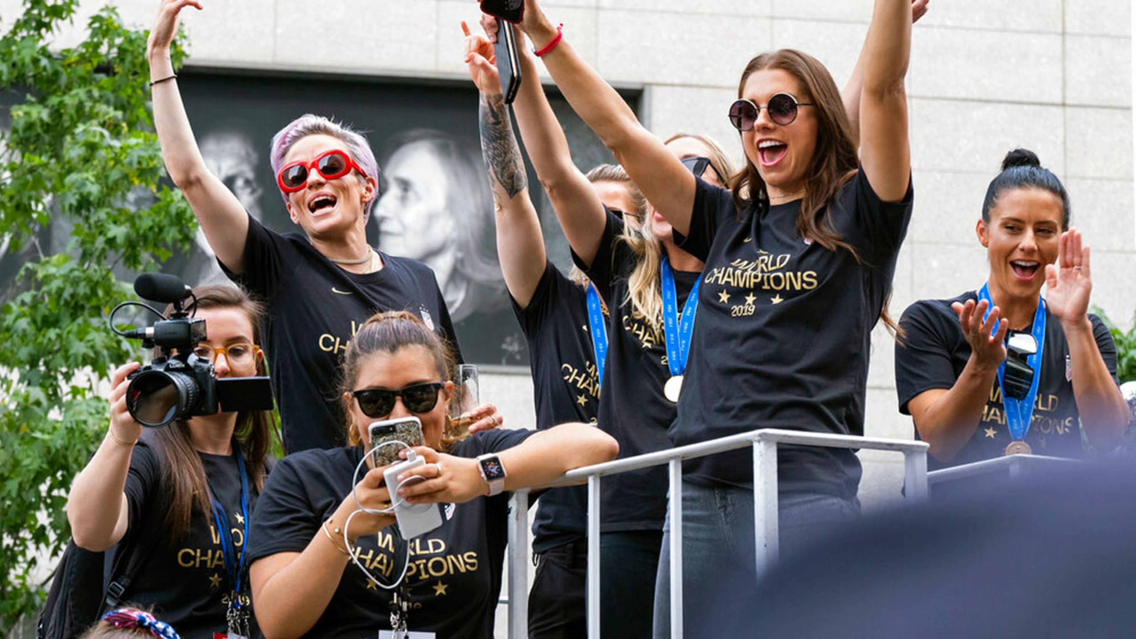 Members of the U.S. women’s soccer team, including Megan Rapinoe, rear left, and Alex Morgan, right foreground, stand on a float before being honored with a ticker tape parade along the Canyon of Heroes in New York, Wednesday, July 10, 2019. The U.S. national team beat the Netherlands 2-0 to capture a record fourth Women’s World Cup title. (AP Photo/Craig Ruttle)