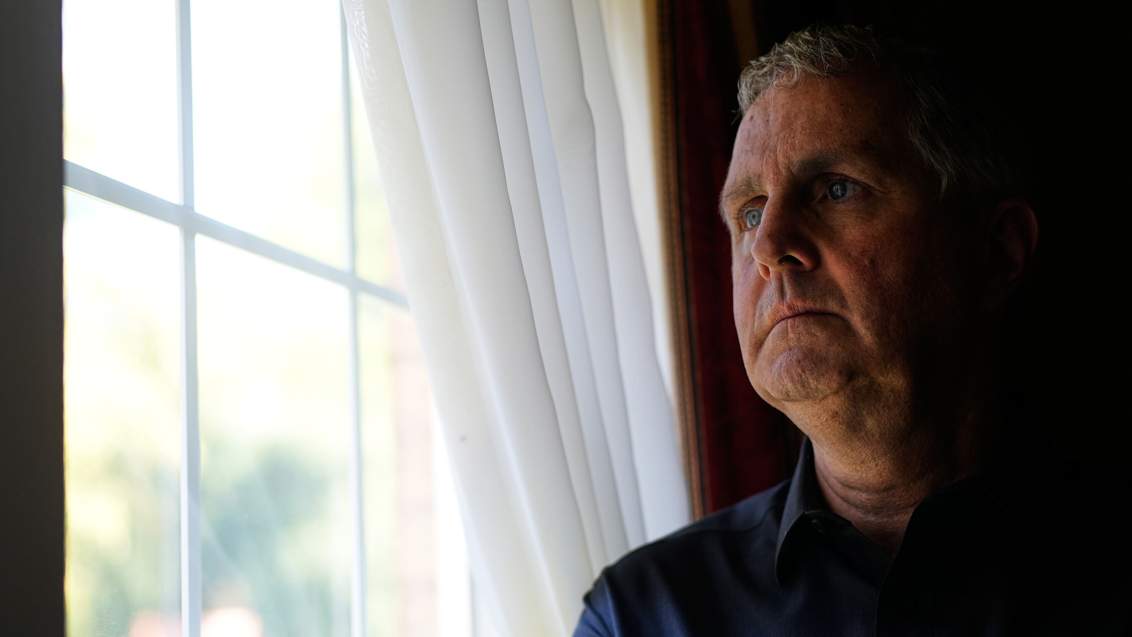 Michael Rabbitt poses for a photo at his home in Chicago, Thursday, Aug. 27, 2026. (AP Photo/Nam Y. Huh)