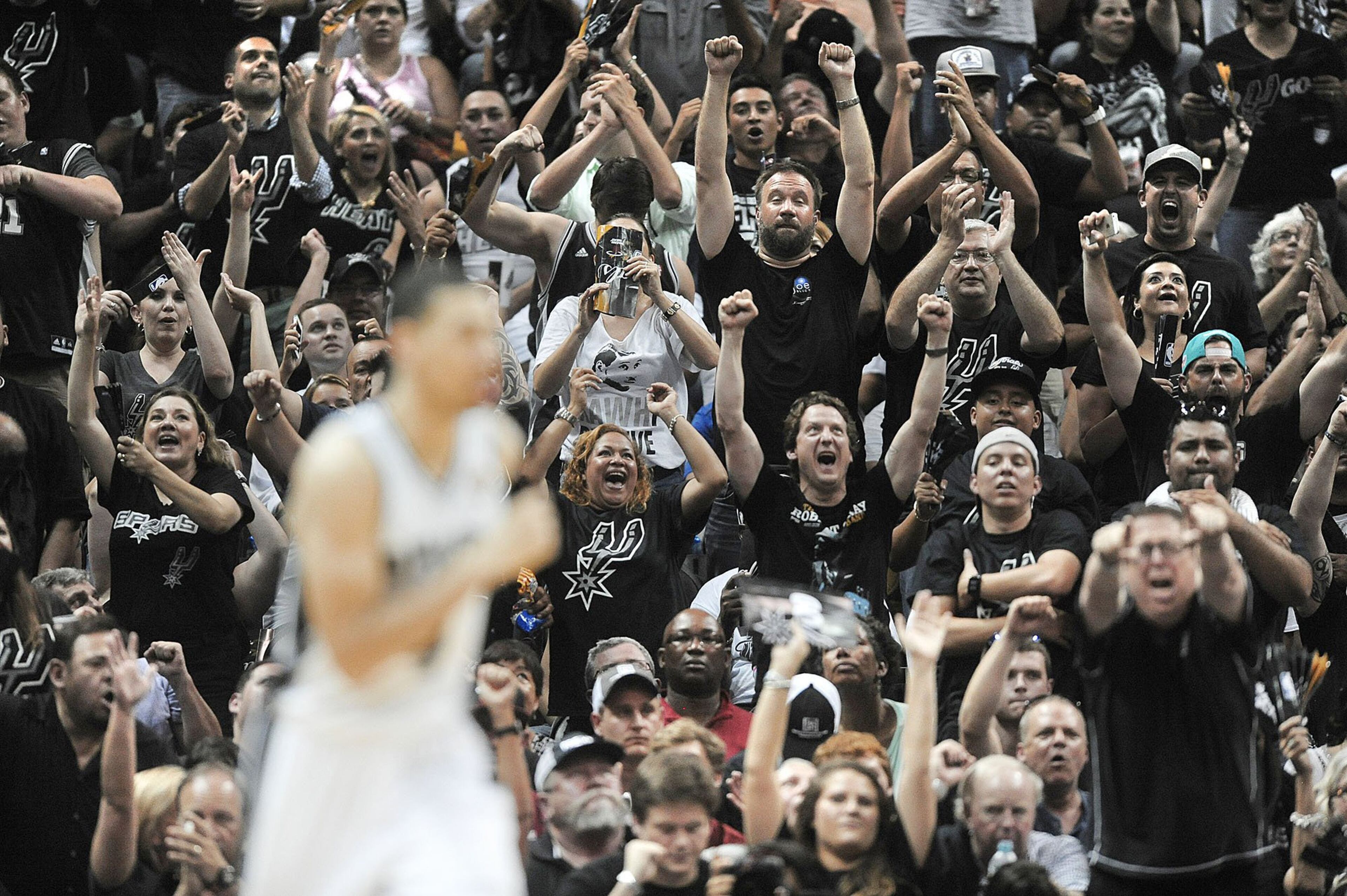 San Antonio Spurs fans cheer after Danny Green hit a 3-point shot during the second half against the Miami Heat in Game 1 of the NBA Finals on Thursday, June 5, 2014, at the AT&T Center in San Antonio. The Spurs won, 110-95. (Michael Laughlin/Sun Sentinel/MCT)