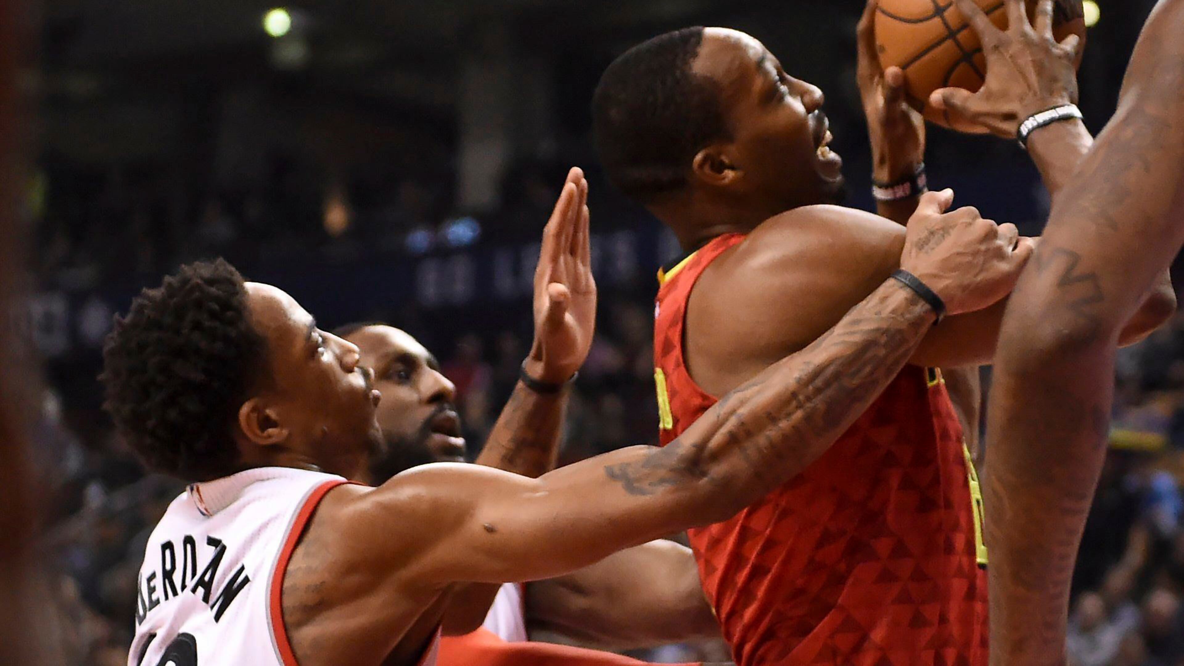 Toronto Raptors guard DeMar DeRozan (10) fouls Atlanta Hawks center Dwight Howard (8) during the first half of an NBA basketball game Saturday, Dec. 3, 2016, in Toronto. (Frank Gunn/The Canadian Press via AP)