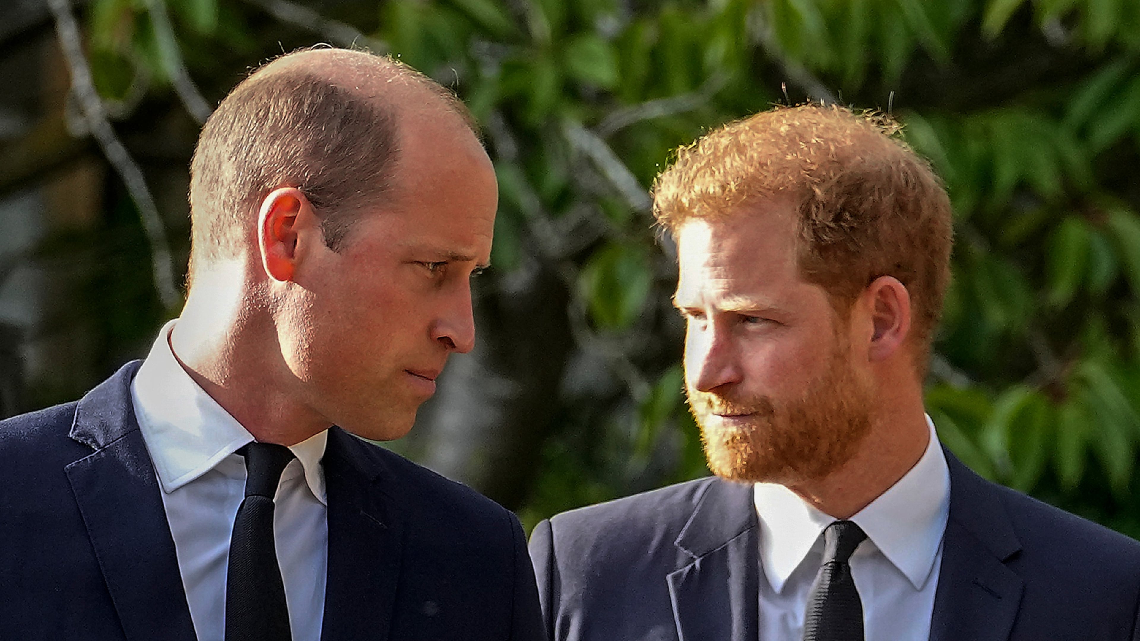 FILE - Britain's Prince William and Britain's Prince Harry walk beside each other after viewing the floral tributes for the late Queen Elizabeth II outside Windsor Castle, in Windsor, England on Sept. 10, 2022. (AP Photo/Martin Meissner, File)