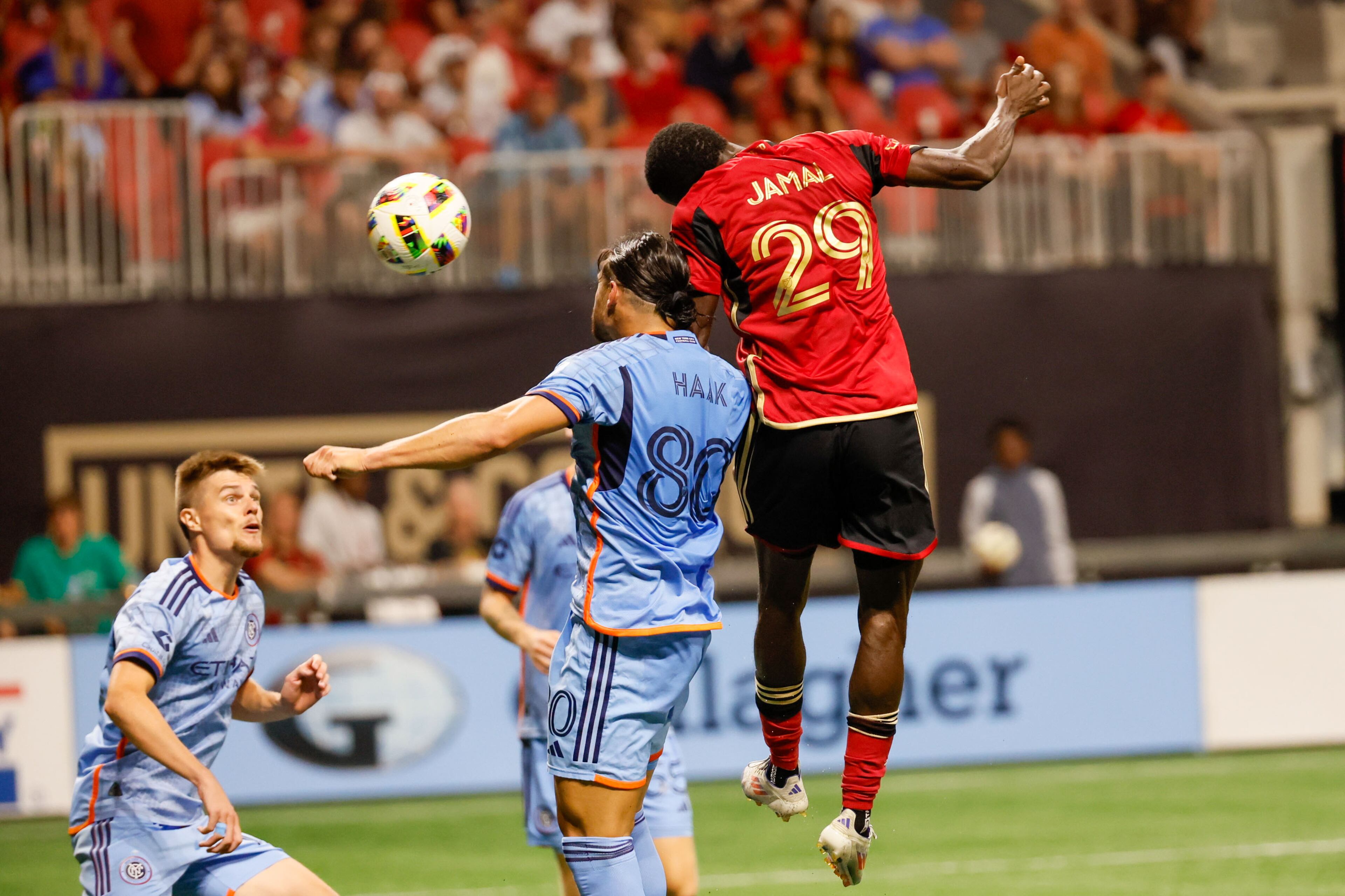 Atlanta United forward Jamal Thiaré (29) jumps for a header, and the ball is cleared off the line by New York City goalkeeper Matt Freese (49) at Mercedes-Benz Stadium on Wednesday, July 17, 2024.
(Miguel Martinez/ AJC)