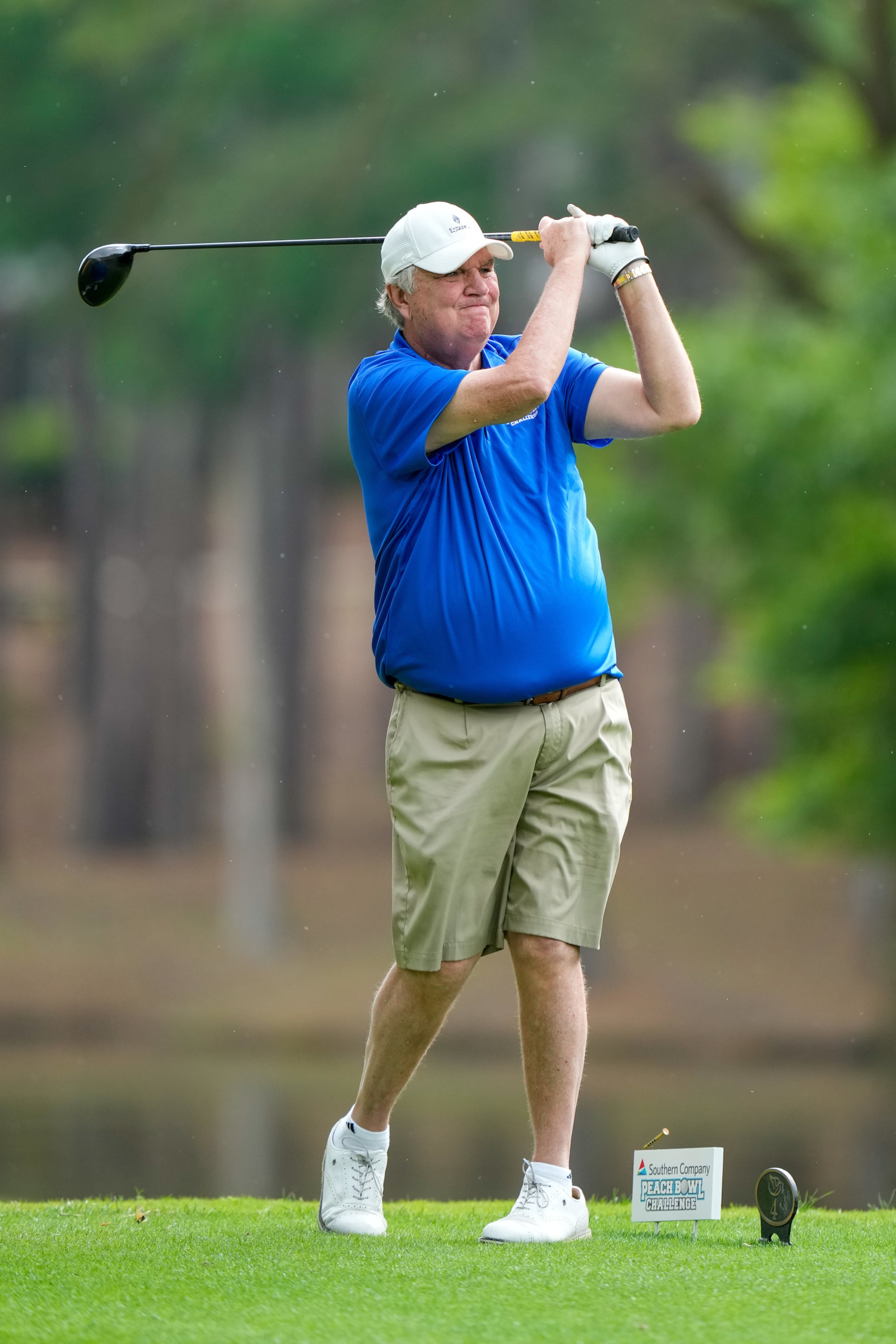 Former Georgia Tech coach Paul Johnson follows the flight of his shot. Photos by Paul Abell