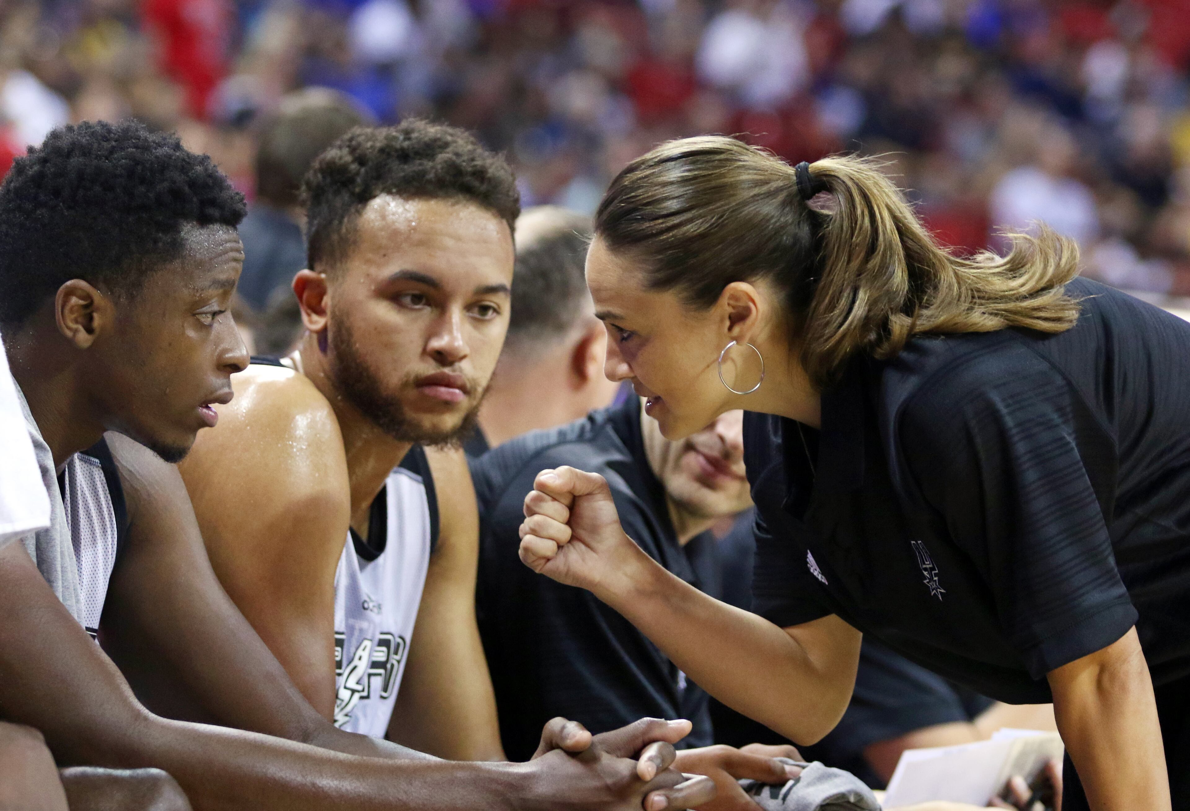 From right to left, NBA Summer League head coach Becky Hammon talks with San Antonio Spurs' Kyle Anderson and Cady Lalanne during an NBA summer league basketball game against the New York Knicks, Saturday, July 11, 2015, in Las Vegas. (AP Photo/Ronda Churchill)