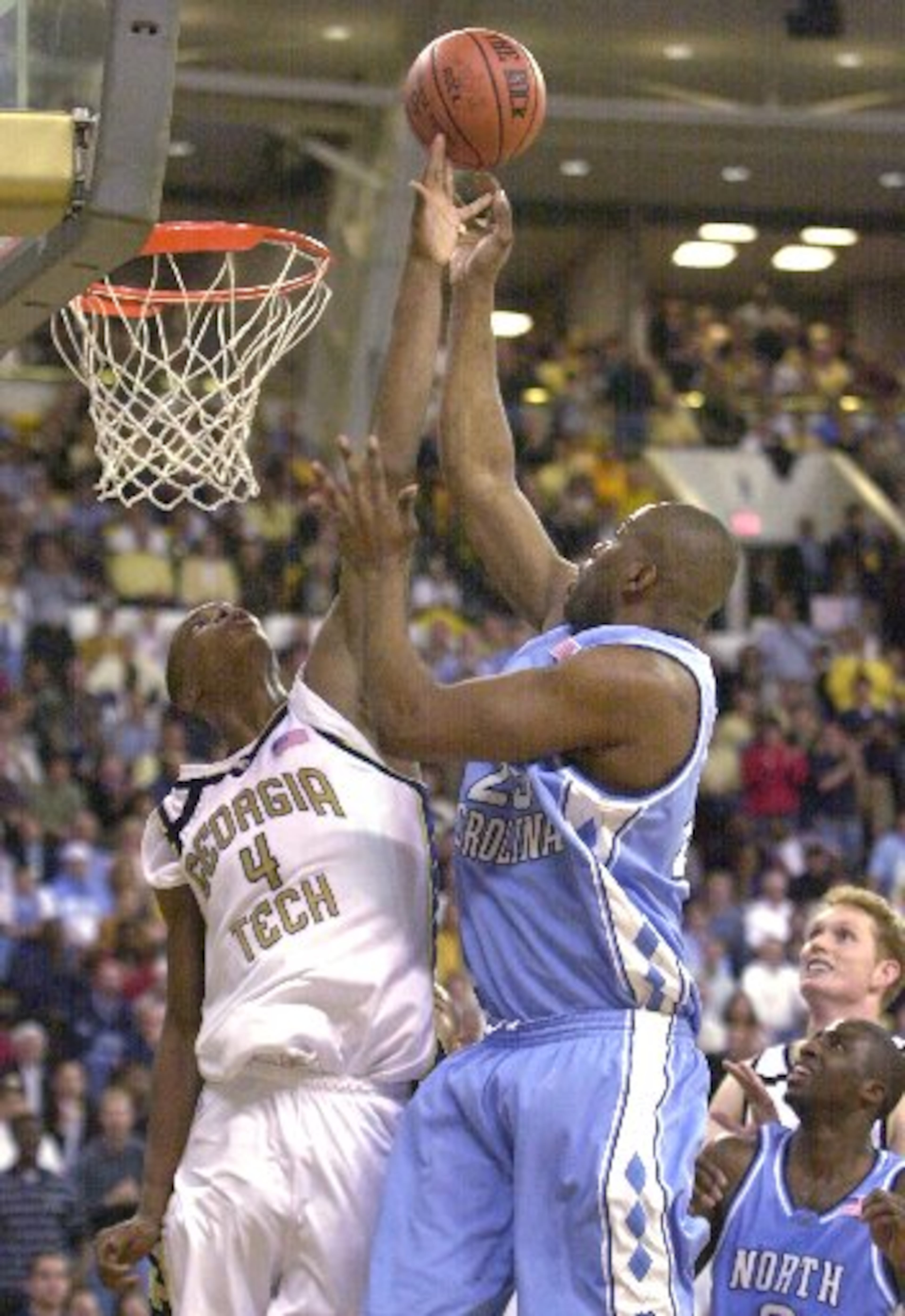 Georgia Tech forward Chris Bosh, left, battles Tar Heels forward Rashad McCants for a rebound on Wednesday, Jan 29, 2003.
