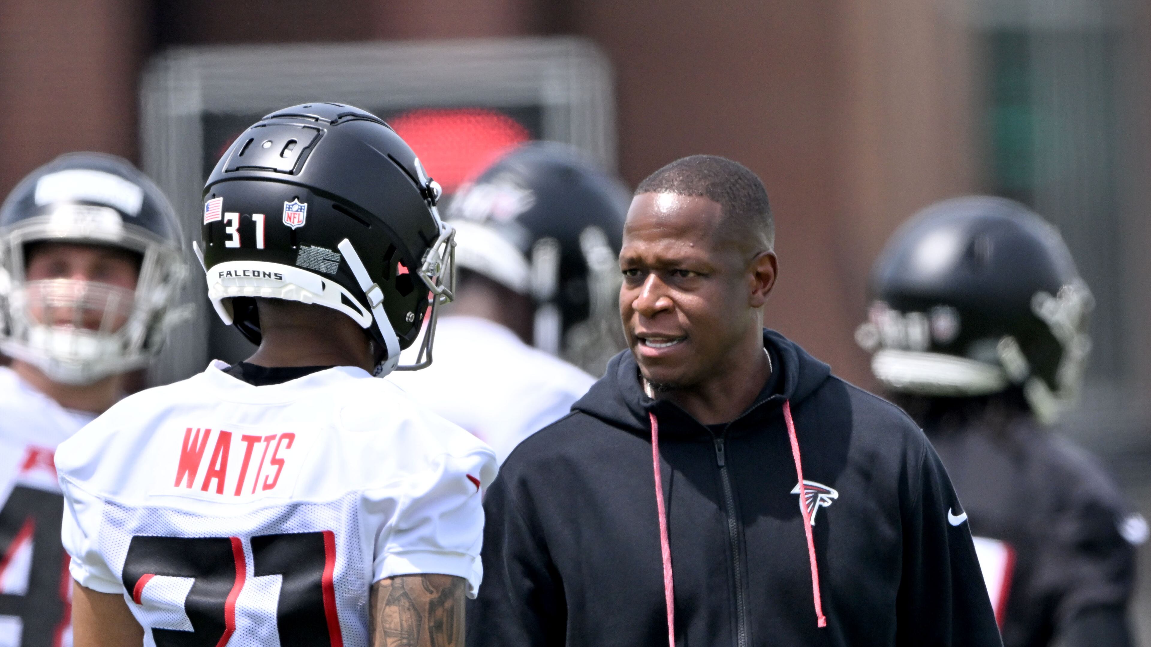 Atlanta Falcons coach Raheem Morris instructs safety Xavier Watts during the rookie minicamp. (Hyosub Shin/AJC)