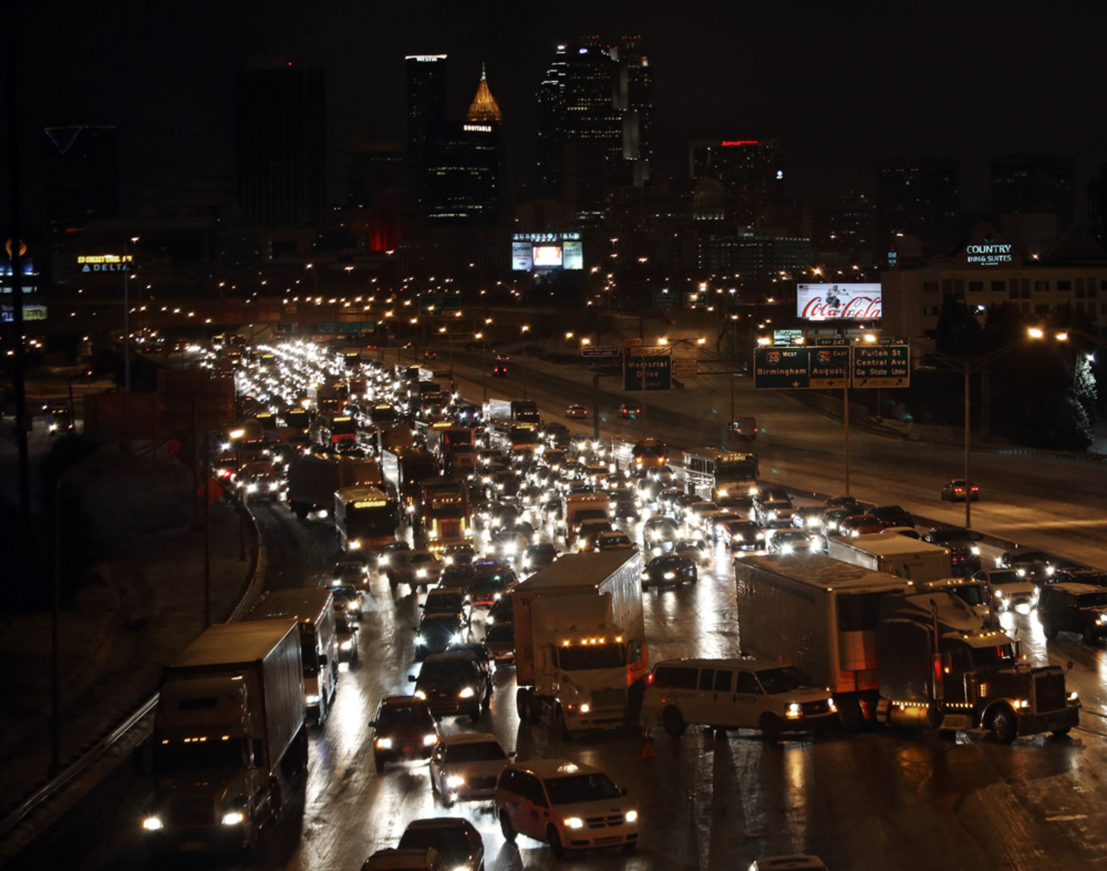 INTERSTATE GRIDLOCK--January 28, 2014 Atlanta: Traffic sits at a standstill with several spun-out trucks blocking much of the Connector Southbound just South of Downtown Atlanta on Tuesday night January 28, 2014. BEN GRAY / BGRAY@AJC.COM