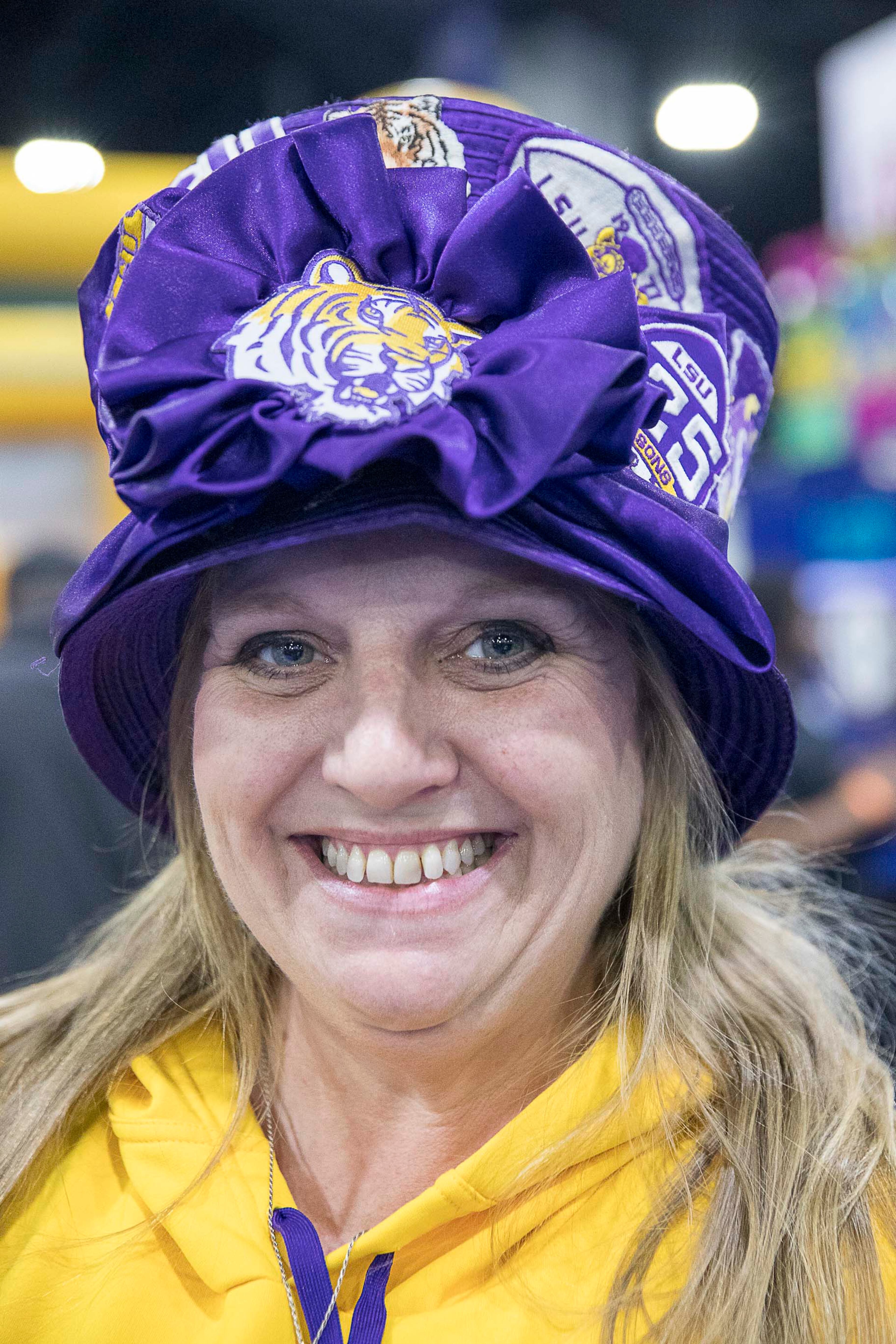 Louisiana State University Tigers football fan Stephanie Ward shows off her custom hat while at the SEC Fan Fare experience at the Georgia World Congress Center in Atlanta, Friday, December 6, 2019. (ALYSSA POINTER/ALYSSA.POINTER@AJC.COM)