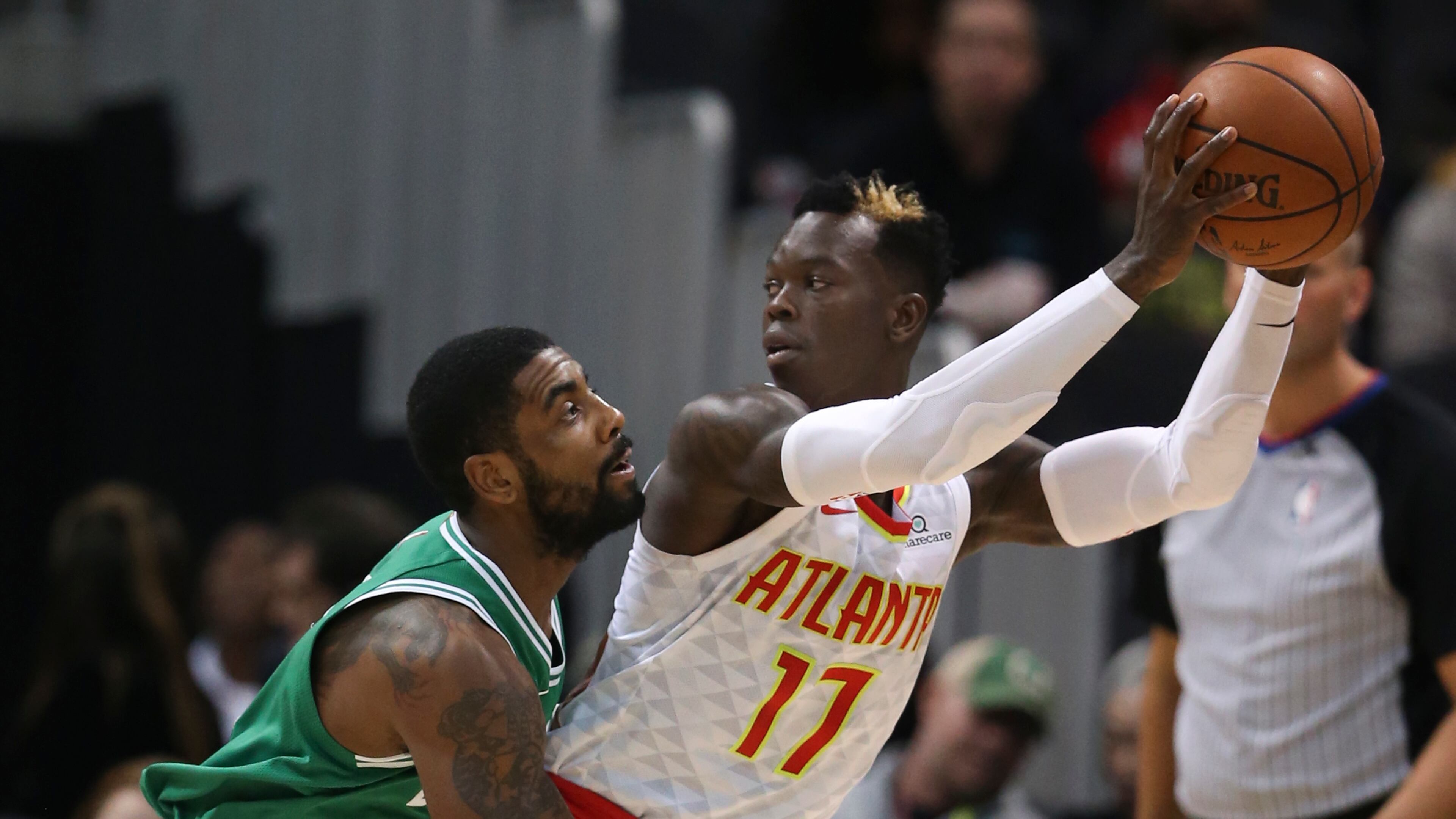 Atlanta Hawks guard Dennis Schroder (17) looks to pass as Boston Celtics guard Kyrie Irving (11) defends during the first half of an NBA basketball game Monday, Nov. 6, 2017, in Atlanta. (AP Photo/John Bazemore)