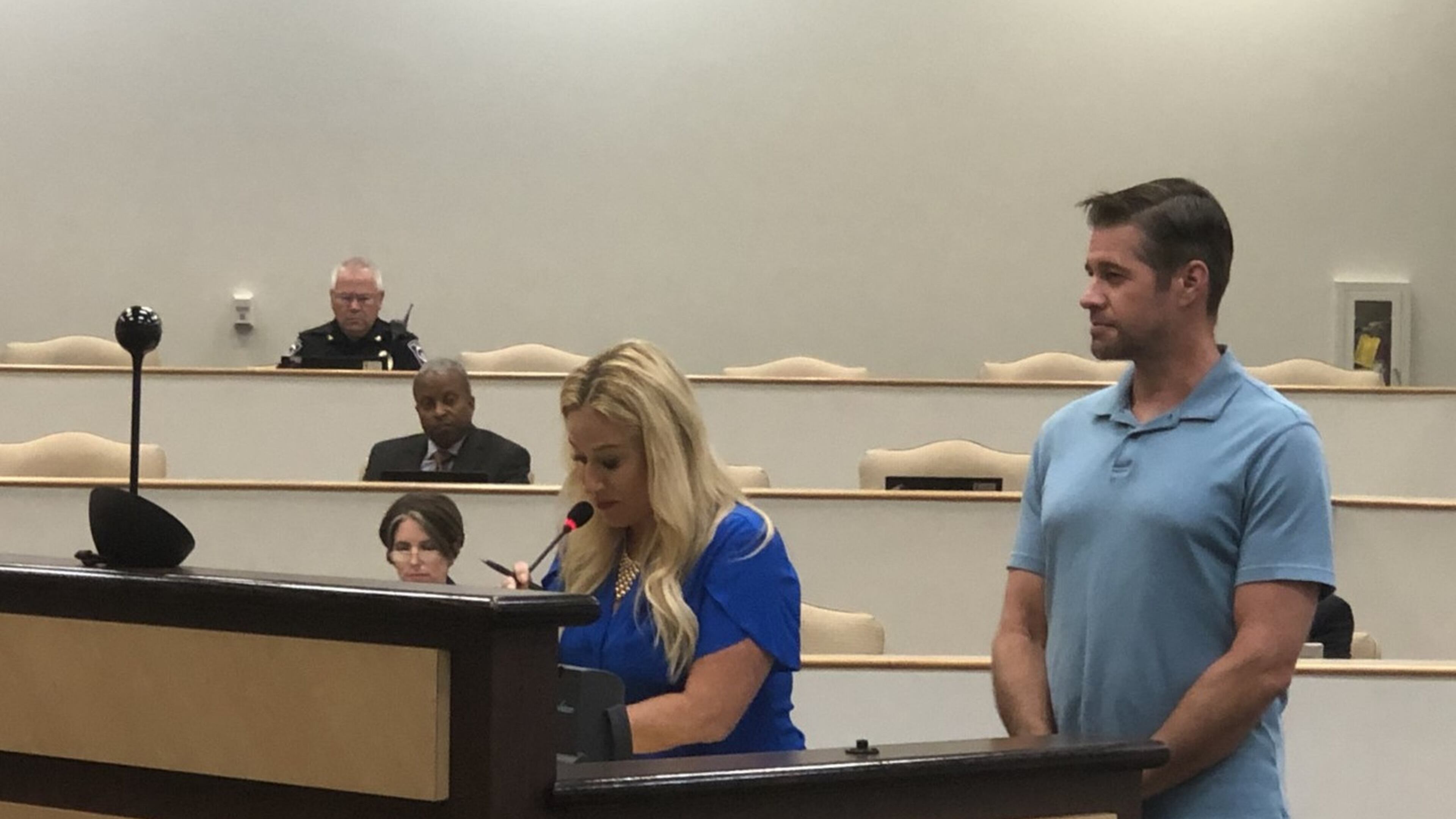Kelly Willyard (right) and Steven Gasper appear before the Gwinnett County Board of Education at the June 18 meeting. ARLINDA SMITH BROADY/AJC