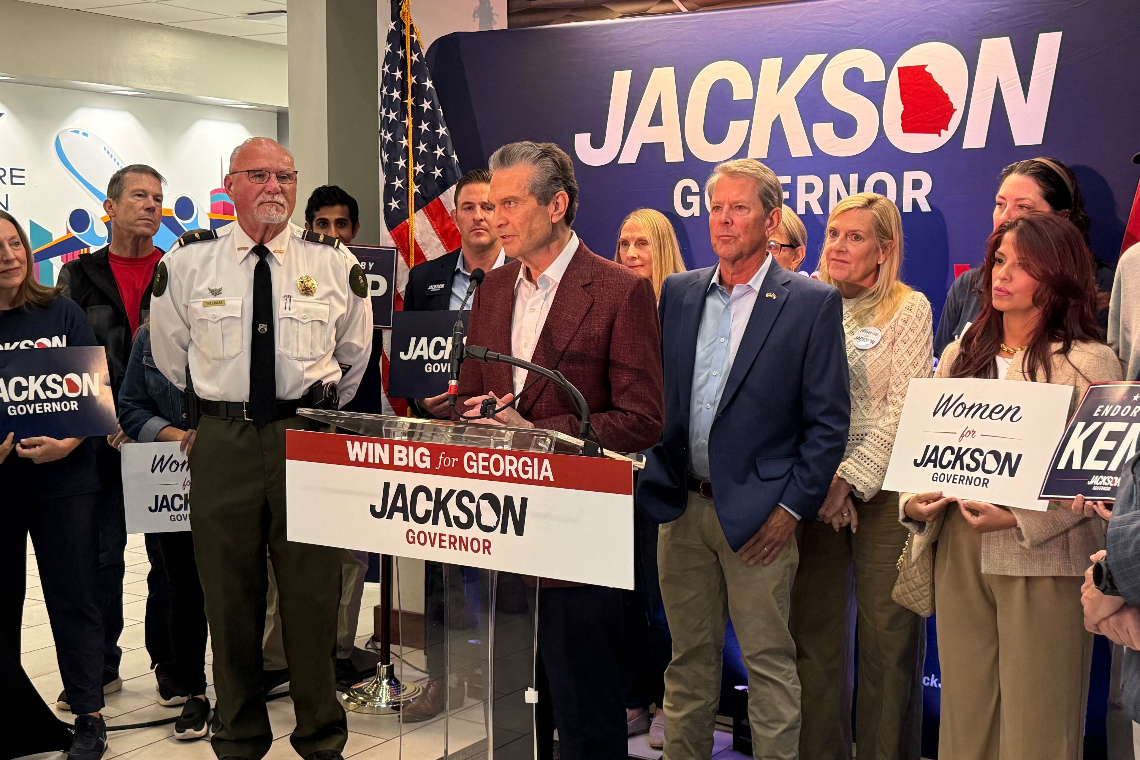 Gov. Brian Kemp and Republican nominee Rick Jackson kick off a daylong fly-around tour at Signature Aviation in Atlanta on Oct. 12, 2026. The two are urging Republicans to cast early ballots ahead of the start of the three-week early voting period on Tuesday. (Greg Bluestein/AJC)