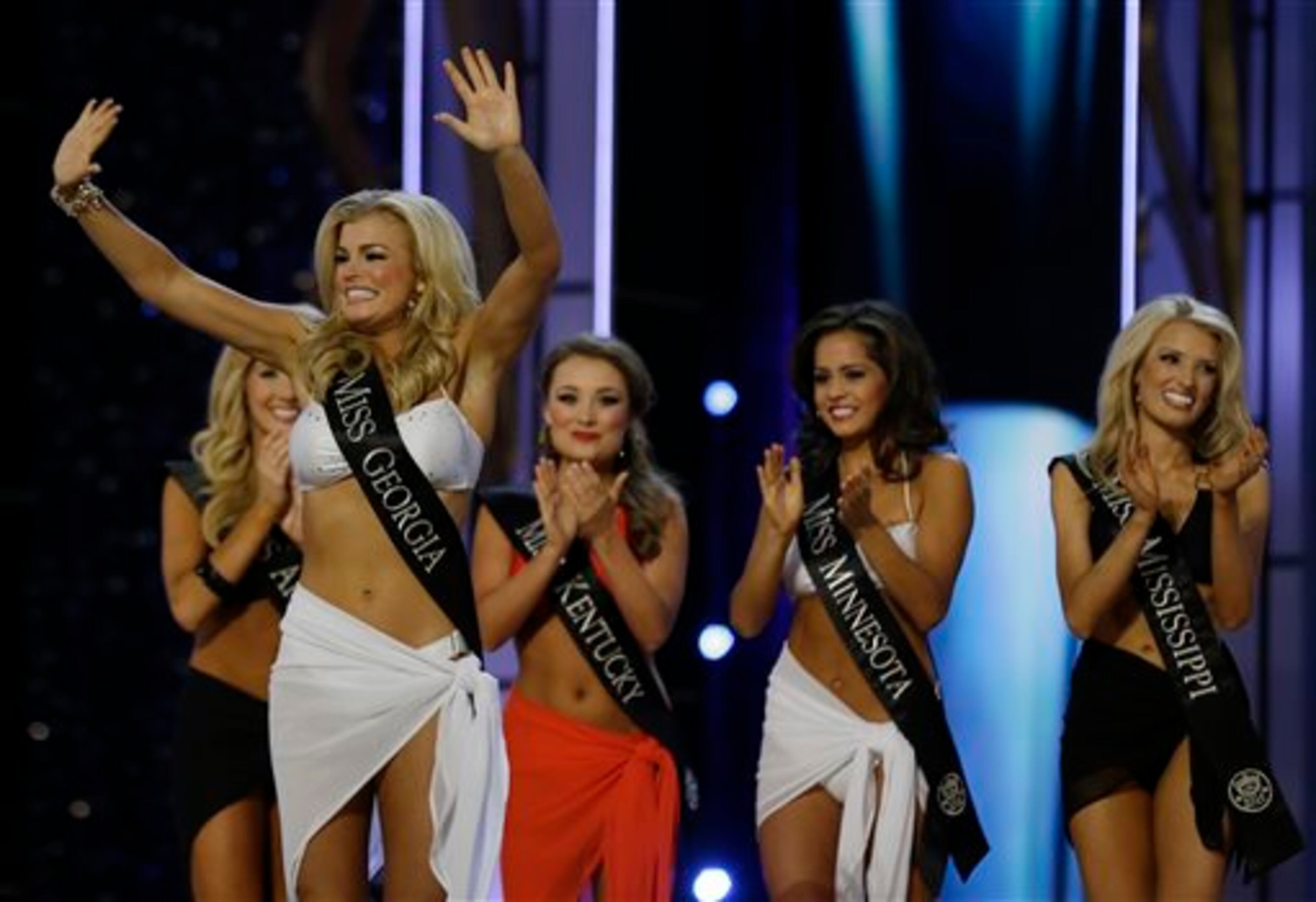 Miss Georgia Carly Mathis acknowledges the crowd after advancing beyond the lifestyle competition during the Miss America 2014 pageant, Sunday, Sept. 15, 2013, in Atlantic City, N.J. (AP Photo/Mel Evans)