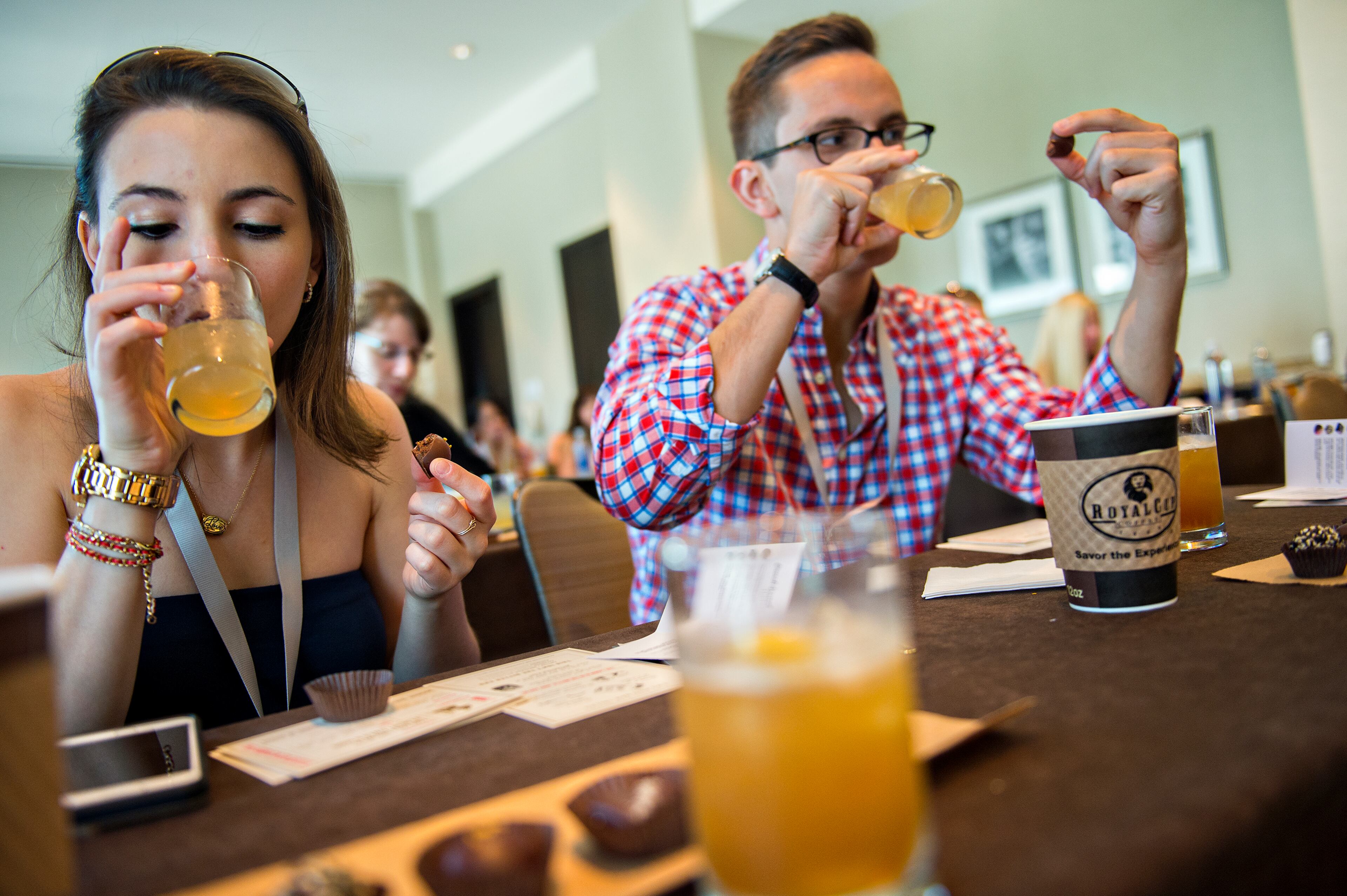 May 30, 2015 Atlanta - Emma Blumstein (left) and Mark Gockowski try a sampling of cocktails and chocolates during the Atlanta Food & Wine Festival at Loews Atlanta Hotel in Midtown on Saturday, May 30, 2015. Thousands of people tasted food and beverages prepared by chefs, brewers, distillers, wine makers and cocktail connoisseurs from all over the country. JONATHAN PHILLIPS / SPECIAL